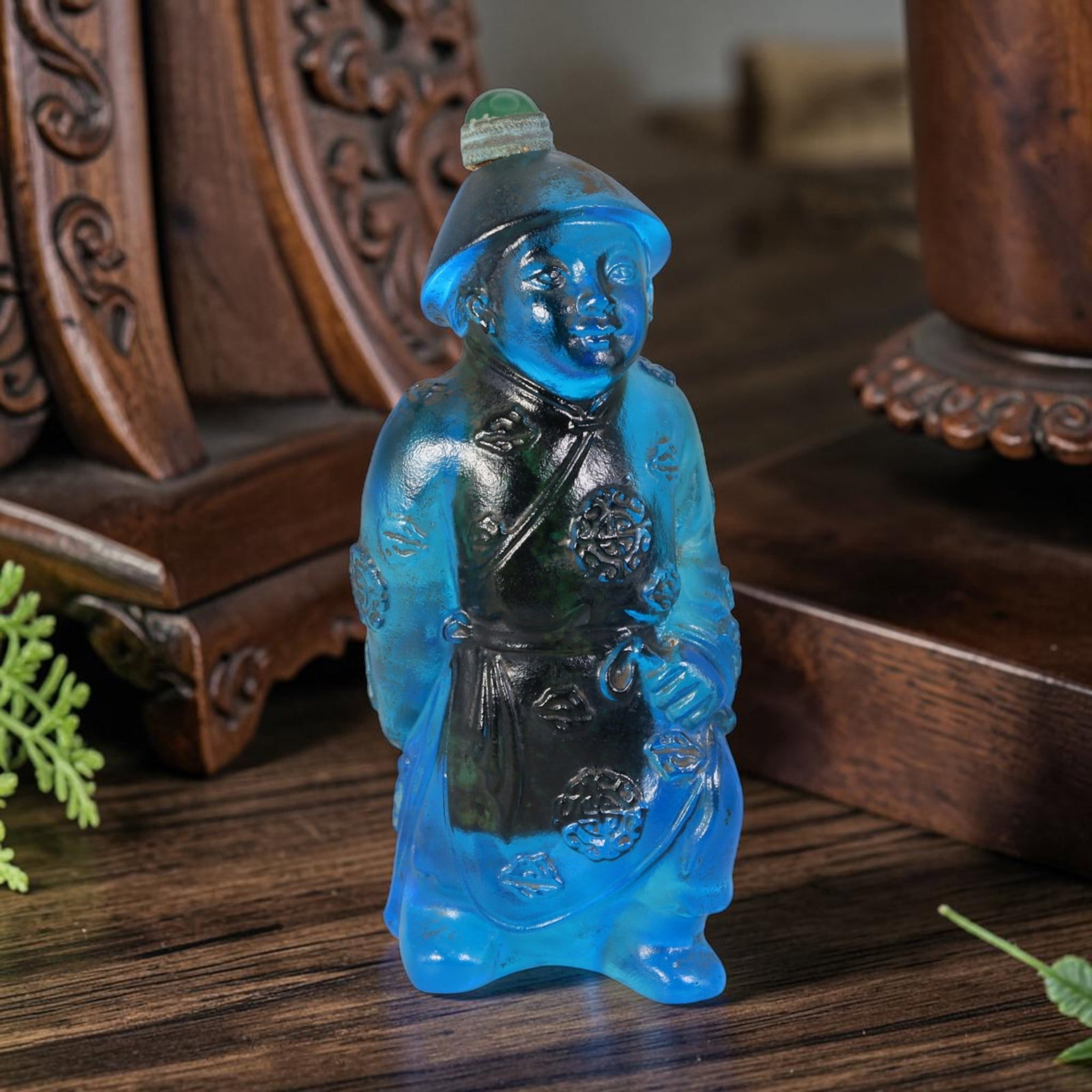 Vintage Chinese Liuli Glass Snuff Bottle - Carved Qing Attendant Figurine Vessel, 43AS: This fully sculpted anthropomorphic snuff bottle is crafted from translucent deep sky-blue frosted vintage Chinese liuli glass, rendered as a stylized Qing dynasty attendant figure complete with tradi