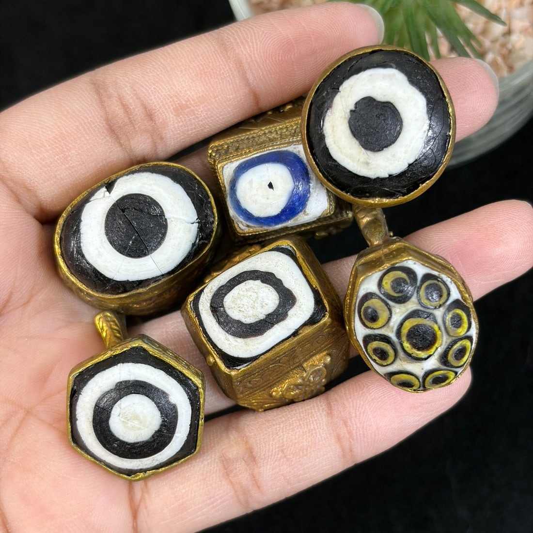 Vintage Qajar Style Gilt Multicolor Evil Eye Glass Inlay Rings Lot, 97AS: This six-piece set consists of untested gilt alloy adjustable rings crafted in traditional Qajar Persian tribal style, each mounted with hand-painted glass evil eye cabochons featuring varied concentr