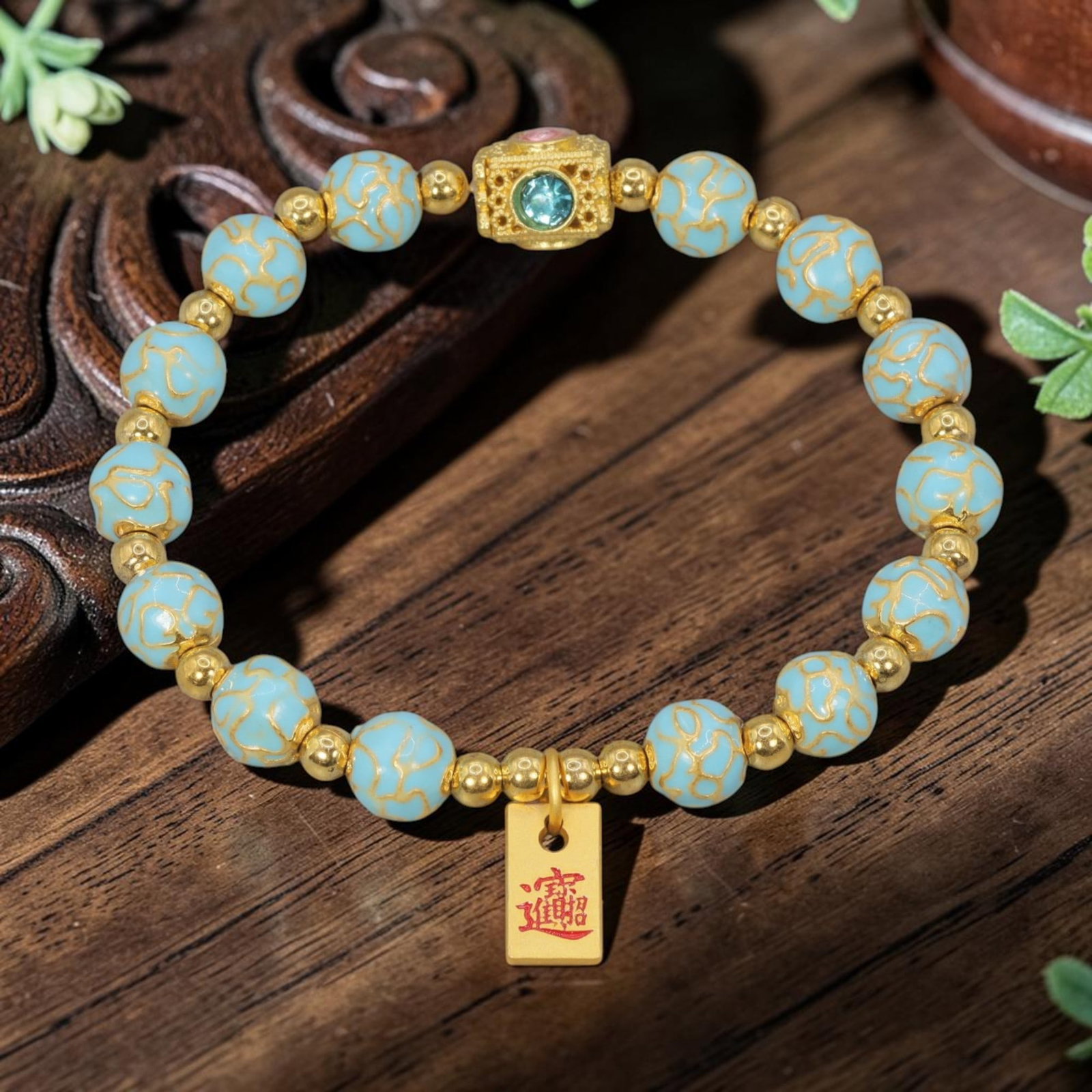 A Chinese Cloisonne Enamel Beaded Bracelet - Light Blue Gold-Tone Wealth Charm, 45YJ: This modern Chinese-style bracelet features 9.60mm round cloisonne enamel beads in a soft light blue hue, each detailed with raised gold-tone cloud patterns. Small smooth gold-tone spacer beads separa