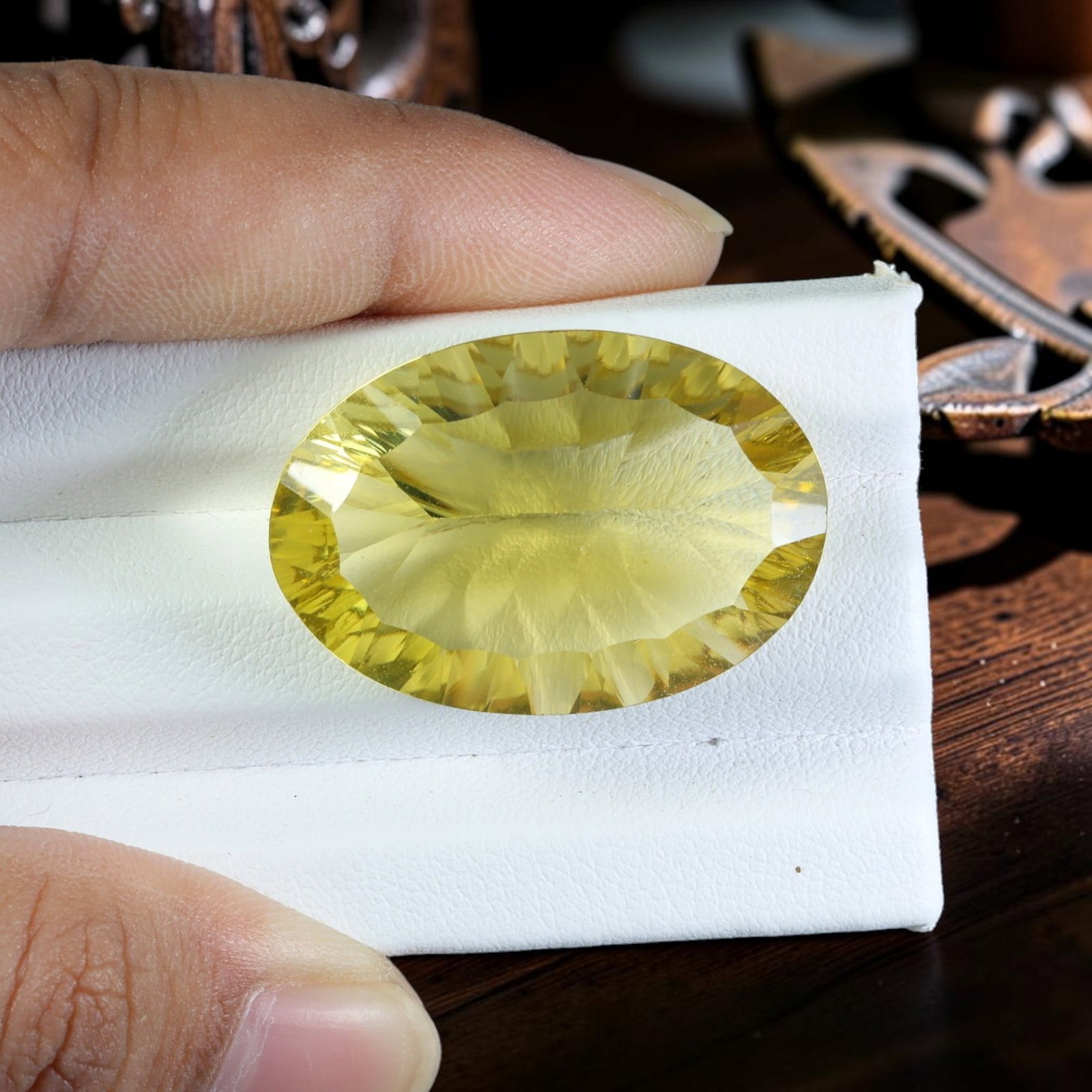 32.08 Carats Natural Lemon Quartz Oval Cut Faceted Gemstone, 96WC: This single large-sized faceted natural lemon quartz features a bright, translucent lemon-yellow hue with excellent internal clarity, expertly fashioned into an elegant oval brilliant cut. The stone m