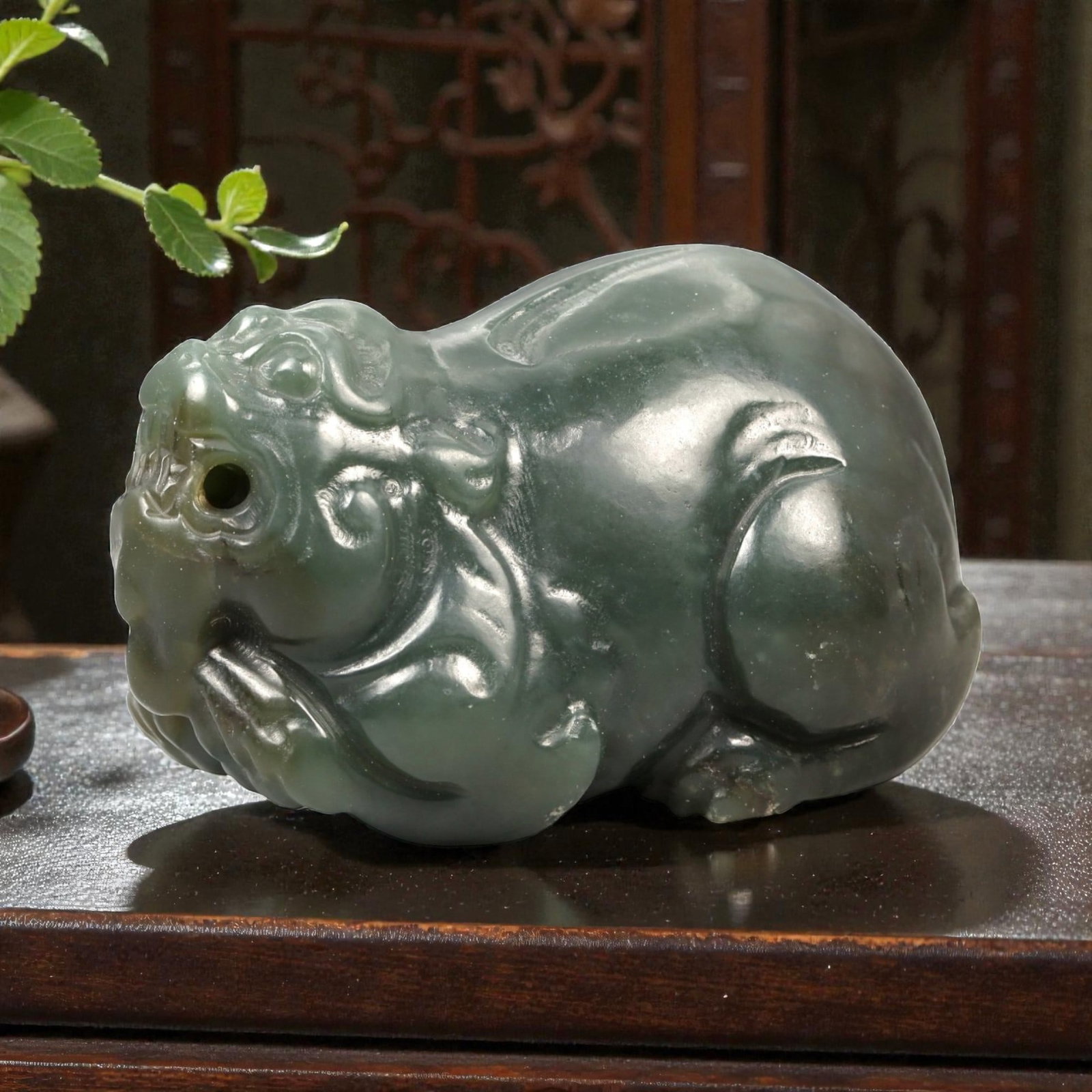 Chinese Jade Pixiu Beast - Carved Animal Figurine 5.3cm, 88ZC: Carved from green jade with natural tonal variation and semi-translucent areas, this sculptural figure represents a pixiu modeled in a compact recumbent posture. The carving is executed fully in the r