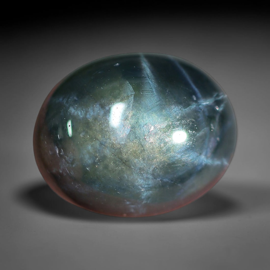4.23 Carats Aqua Mist Star Sapphire Oval Cabochon - Natural Loose Gemstone, 40XC: This luminous oval star sapphire glows with an ethereal aqua-mist blue hue, shifting between soft teal, muted indigo, and subtle green undertones that evoke the calm of tropical waters at dawn. A brig