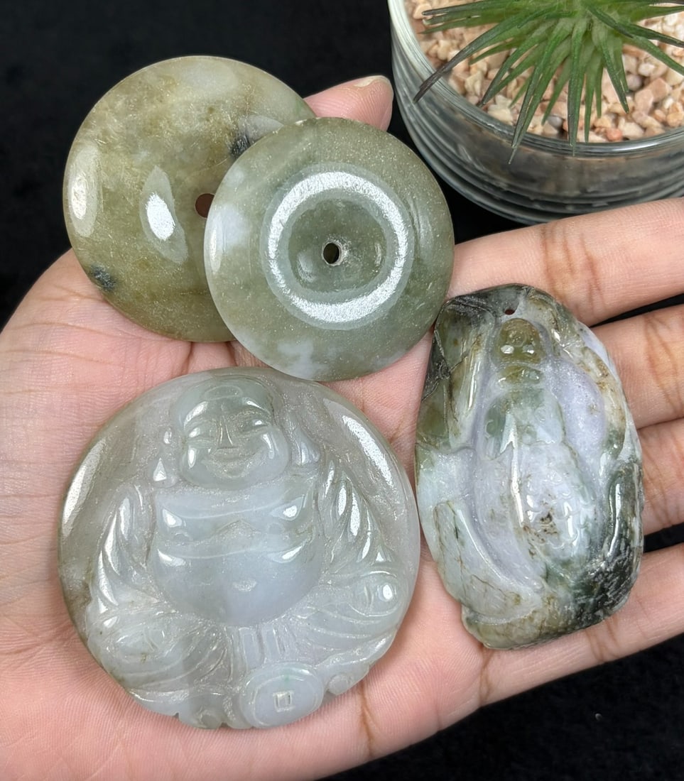 Lot Of 4 Natural Burmese Type A Jadeite Jade Carved Pendants, 78AR: This four-piece set is handcrafted from untreated natural Type A Burmese jadeite jade, consisting of two circular safety coin style donut pendants, a detailed seated laughing Buddha pendant symbolizin