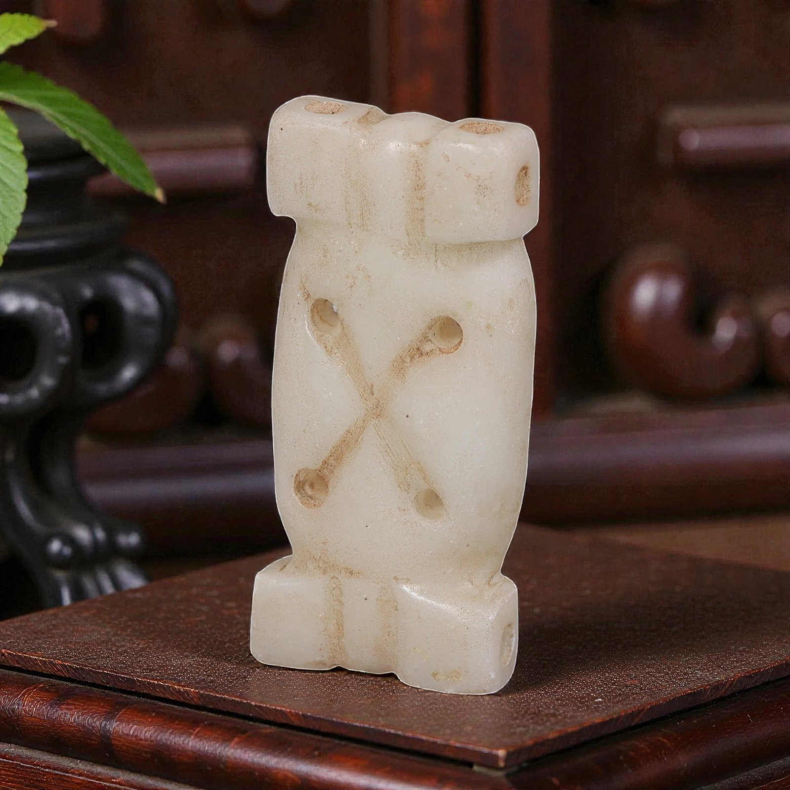 Ancient Near Eastern Marble Ornamental Amulet, Iron Age to Sasanian Period, 67YD: This ancient ornamental amulet is carved from pale white marble, featuring a symmetrical rectangular form with squared terminals at both ends. The body is perforated with multiple holes, including an 