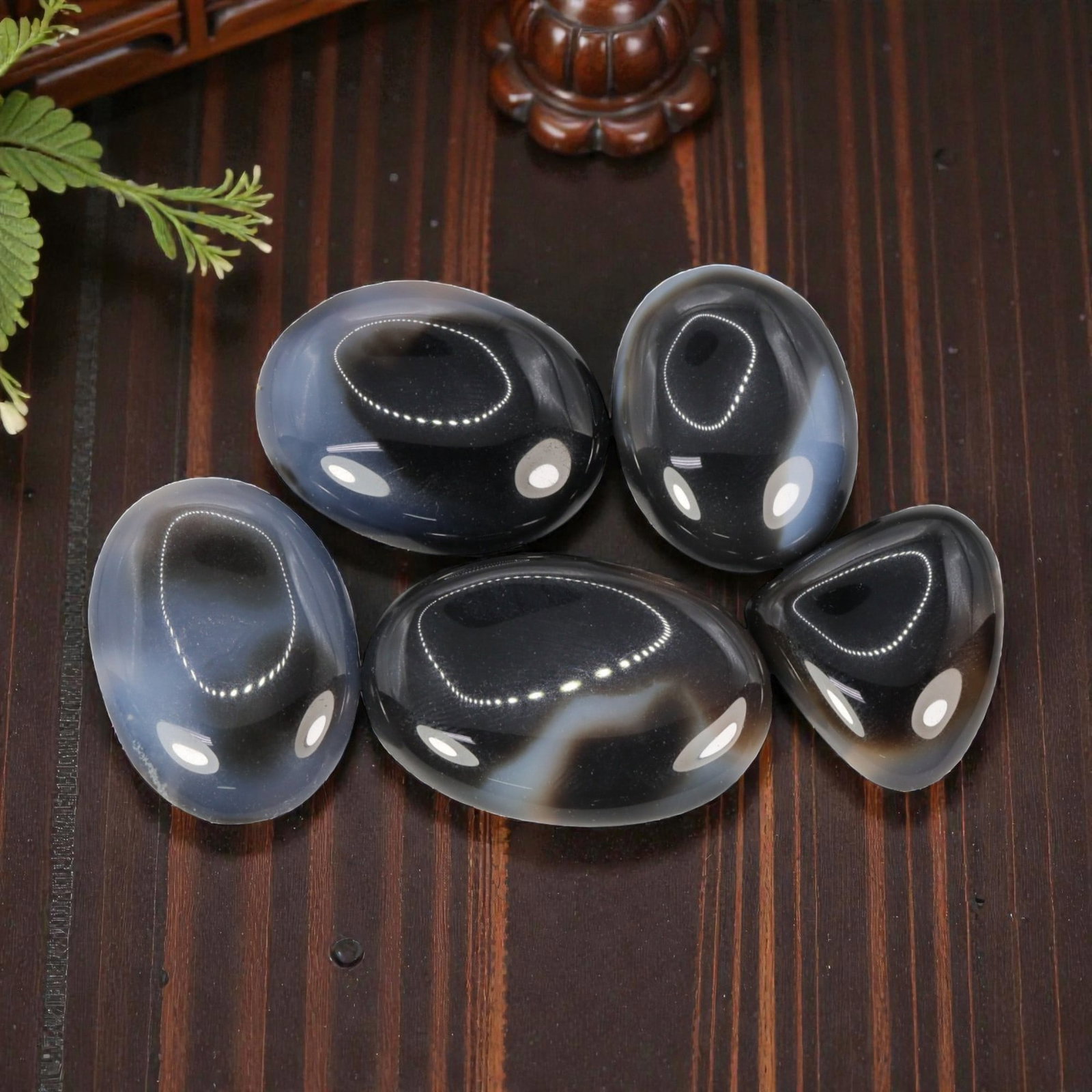256.26 Carats Natural Banded Agate Cabochon Parcel (5 Pieces), 84WC: This elegant set of 5 polished banded agate cabochons features a striking monochromatic palette of deep black, cool grey, and soft blue-grey tones, defined by natural, flowing banding patterns. The ca