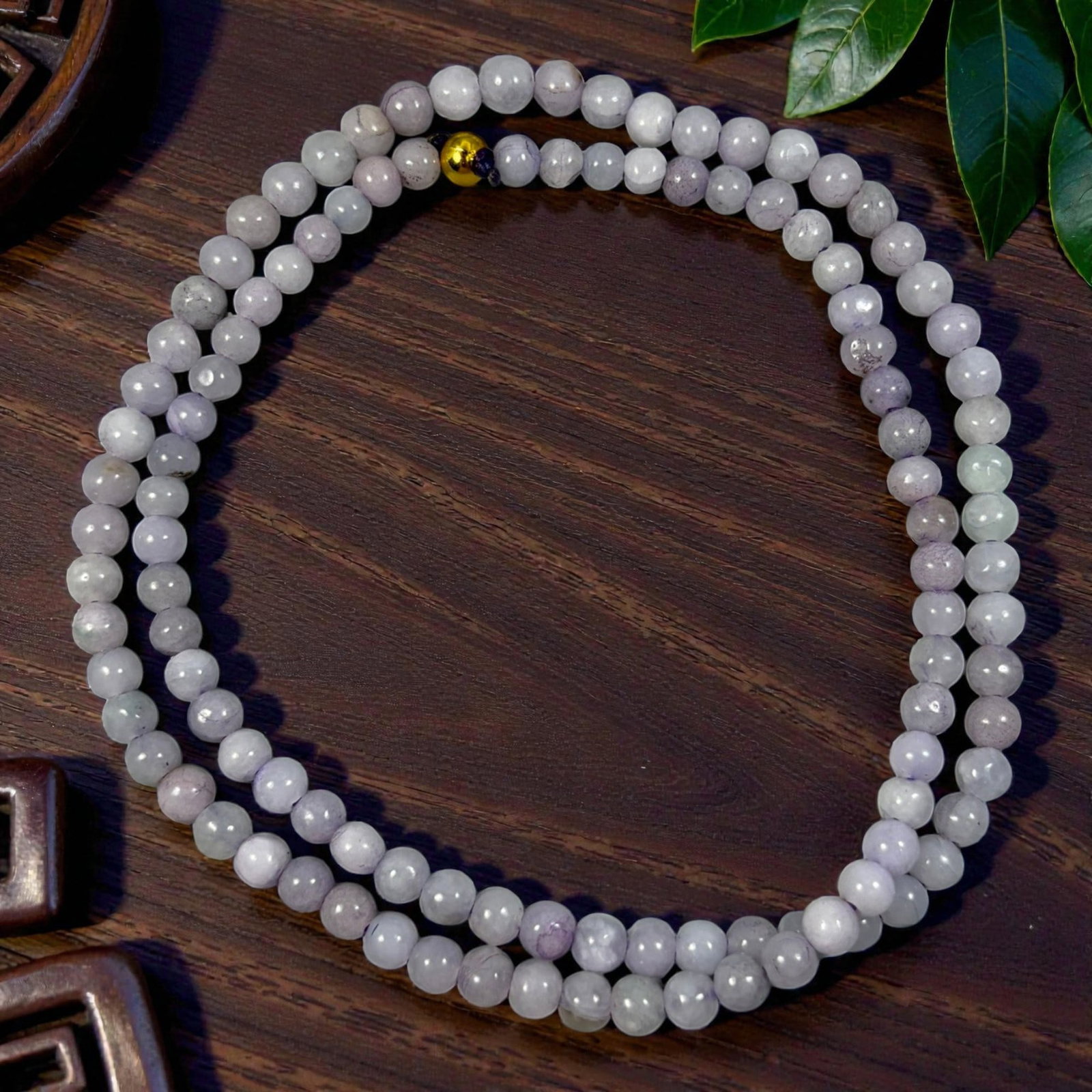 Natural Burmese Lavender Type A Jadeite Jade Bead Necklace, 40YG: A continuous strand of evenly spherical polished Type A jadeite beads presenting soft pale lavender blended with milky off-white natural hues, with subtle internal mineral inclusions, faint veining an