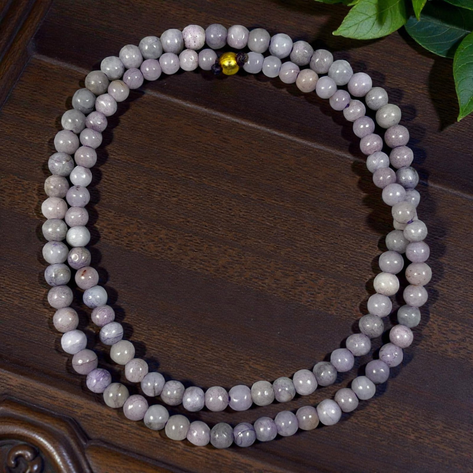 Natural Burmese Lavender Type A Jadeite Jade Bead Necklace, 38YG: A continuous strand of uniformly spherical polished Type A jadeite beads exhibiting soft muted lavender blended with pale off-white natural tones, accented by subtle internal mineral flecks, faint vei