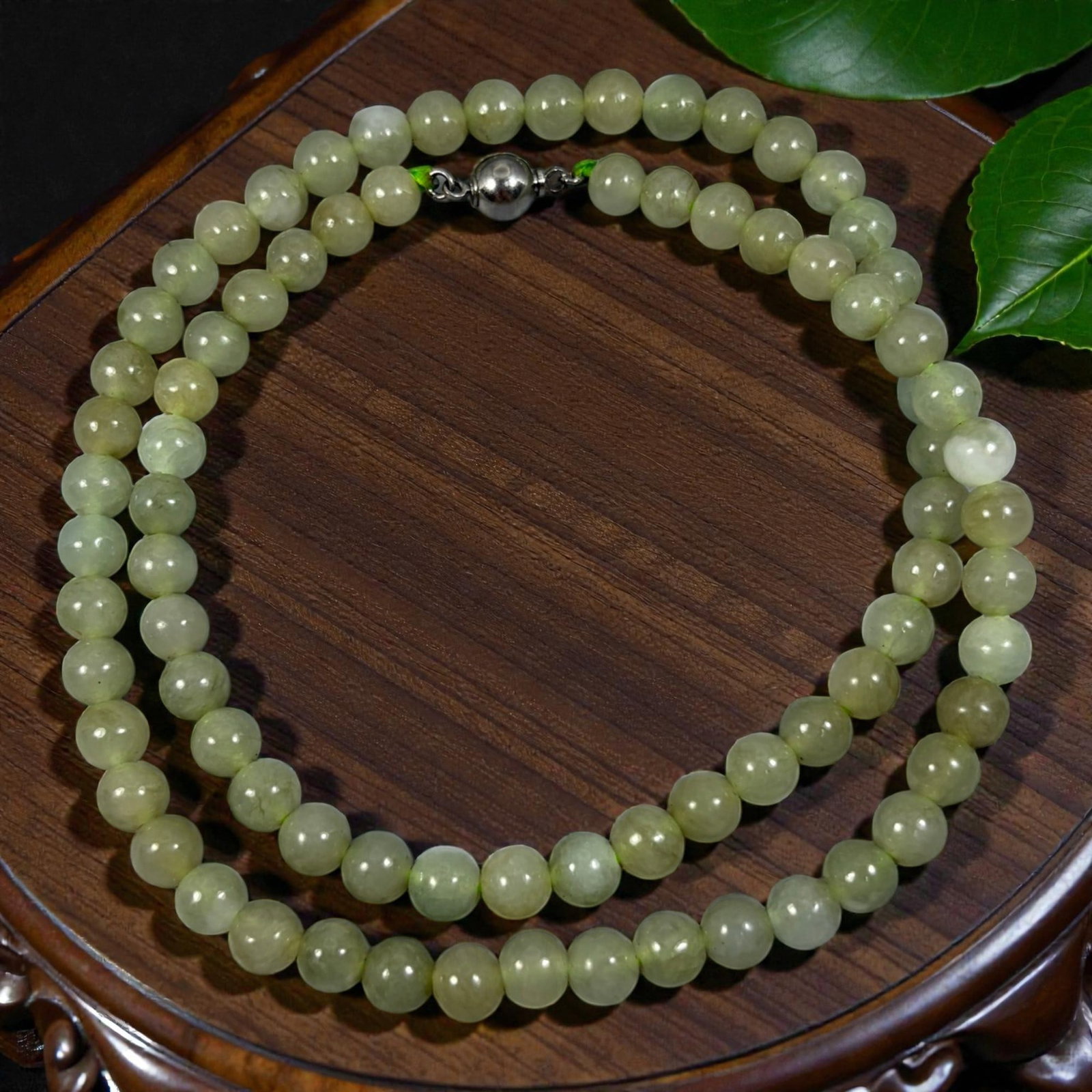 Natural Burmese Pale Yellowish Green Type A Jadeite Jade Bead Necklace, 35YG: A continuous strand of evenly spherical polished Type A jadeite beads presenting soft pale yellowish-green natural coloration, accompanied by subtle internal mineral inclusions and mild tonal differen