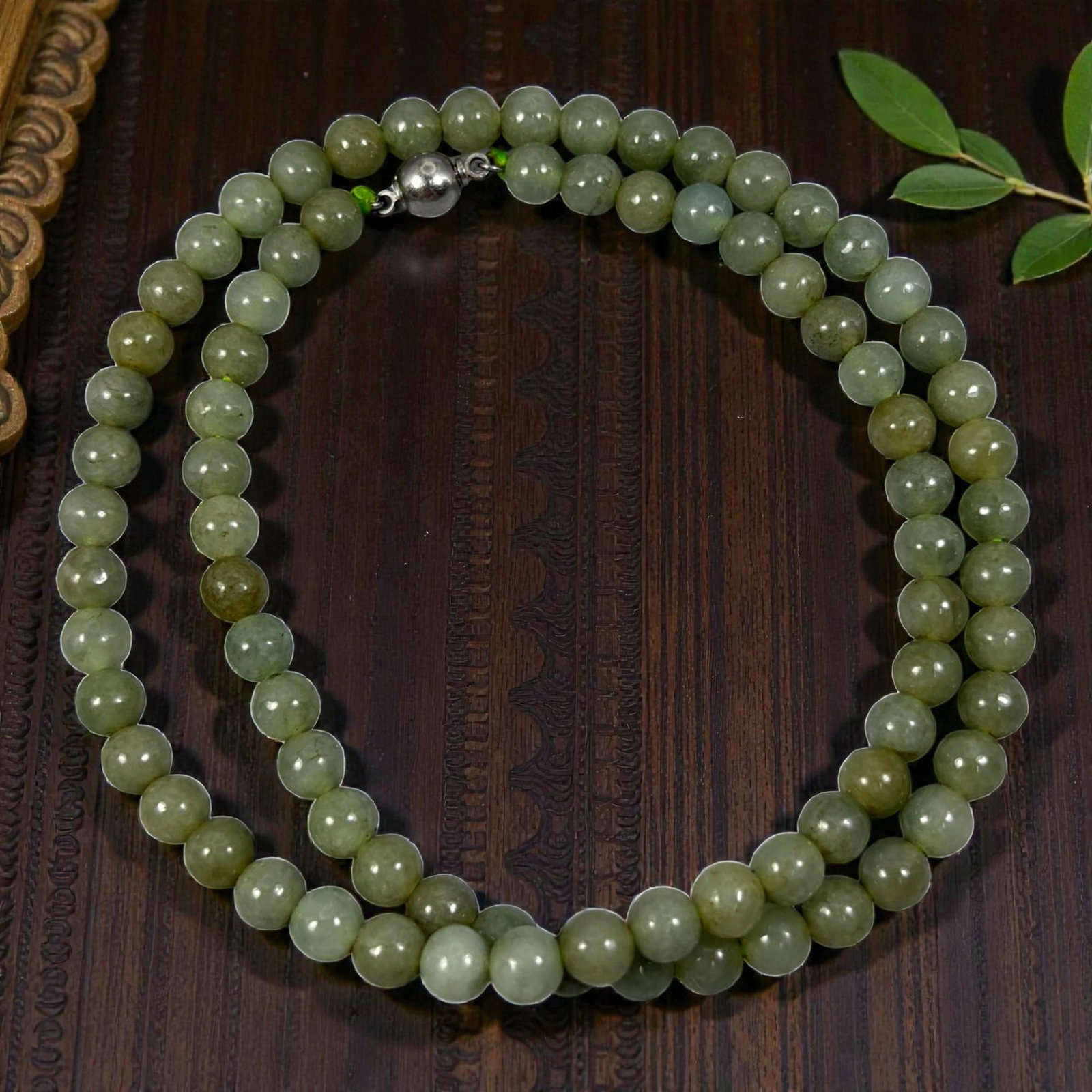 Natural Burmese Olive Green Type A Jadeite Jade Bead Necklace, 28YG: A continuous strand of uniformly spherical polished Type A jadeite beads rendered in a muted olive green hue, featuring subtle natural internal mineral inclusions and slight tonal variations across in