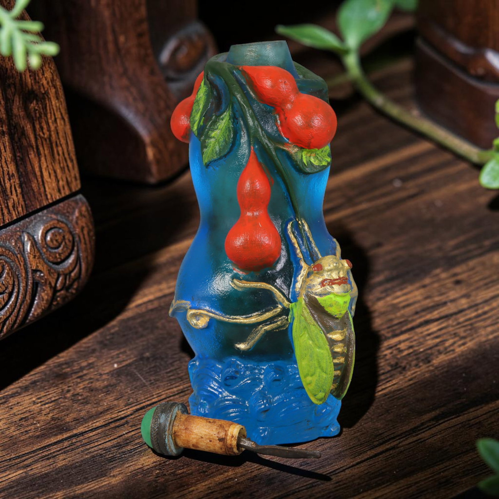 Vintage Chinese Liuli Glass Snuff Bottle - Cicada and Gourd Relief, 49AS: This snuff bottle is crafted from translucent blue frosted liuli glass, shaped in a natural gourd form. The surface features applied relief carving of red gourd vines alongside a gilded and painted ci