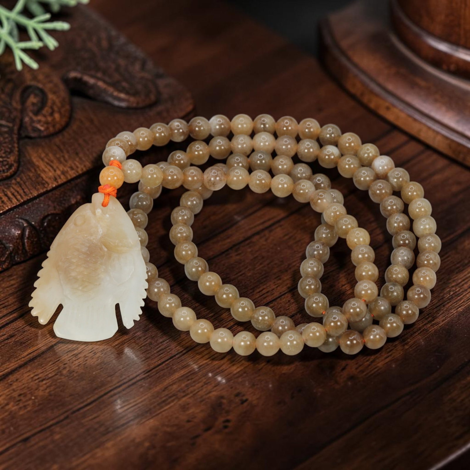 Natural Hetian Sugar Jade Necklace - Carved Fish Pendant, 69YJ: This necklace features a carved fish pendant made from natural Hetian sugar jade, paired with matching round Hetian sugar jade beads. The pendant is crafted from two-toned sugar jade, with a pale whit