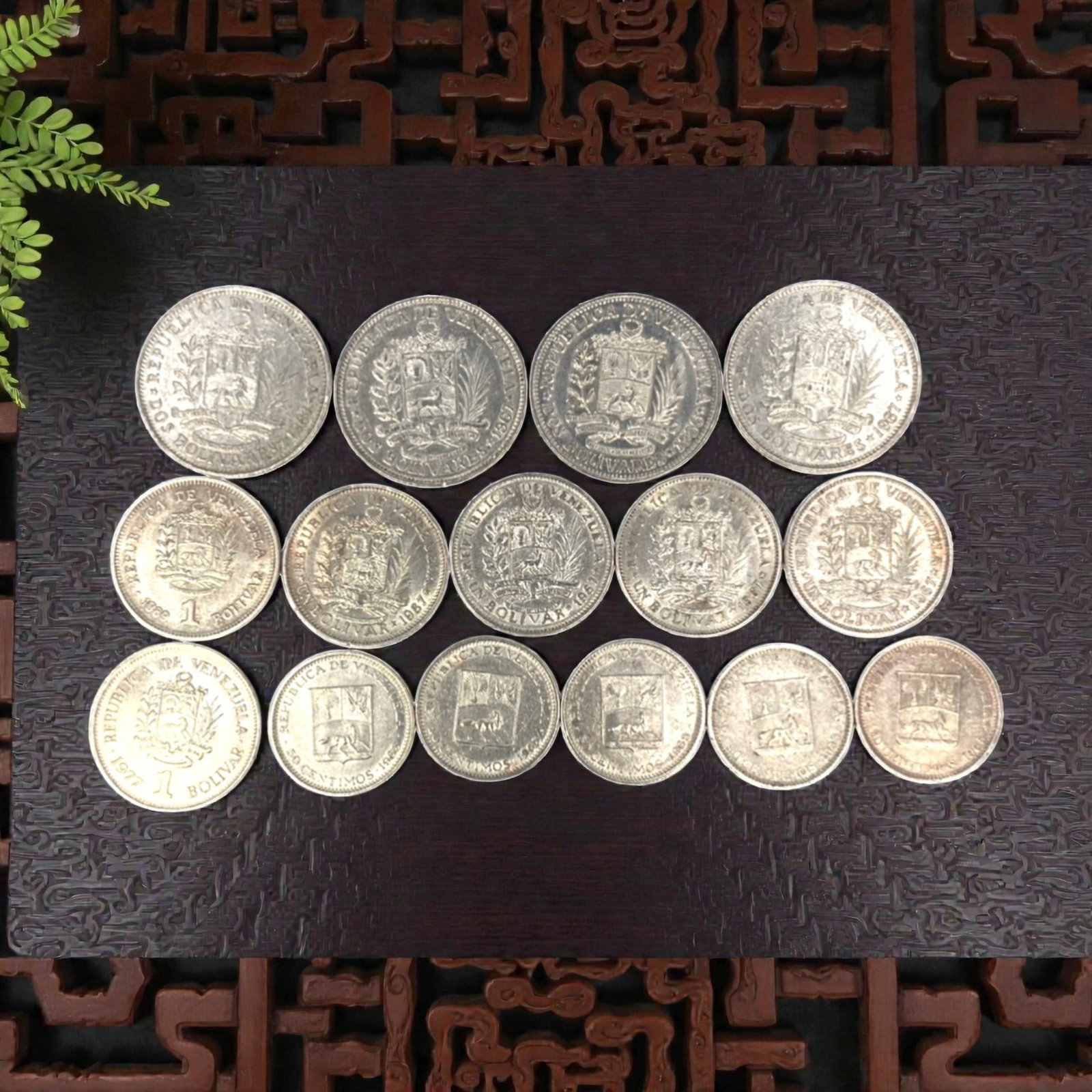 VENEZUELA: Bolivarian Legacy - 15-Piece Coins Set, 1965-1990, 20-27mm, 53ZJ: This 15-Piece Coins Set of Venezuelan coins, minted between 1965 and 1990, encapsulates the nation's enduring Bolivarian legacy and evolving economic identity. Ranging from 20 to 27mm in diameter, the