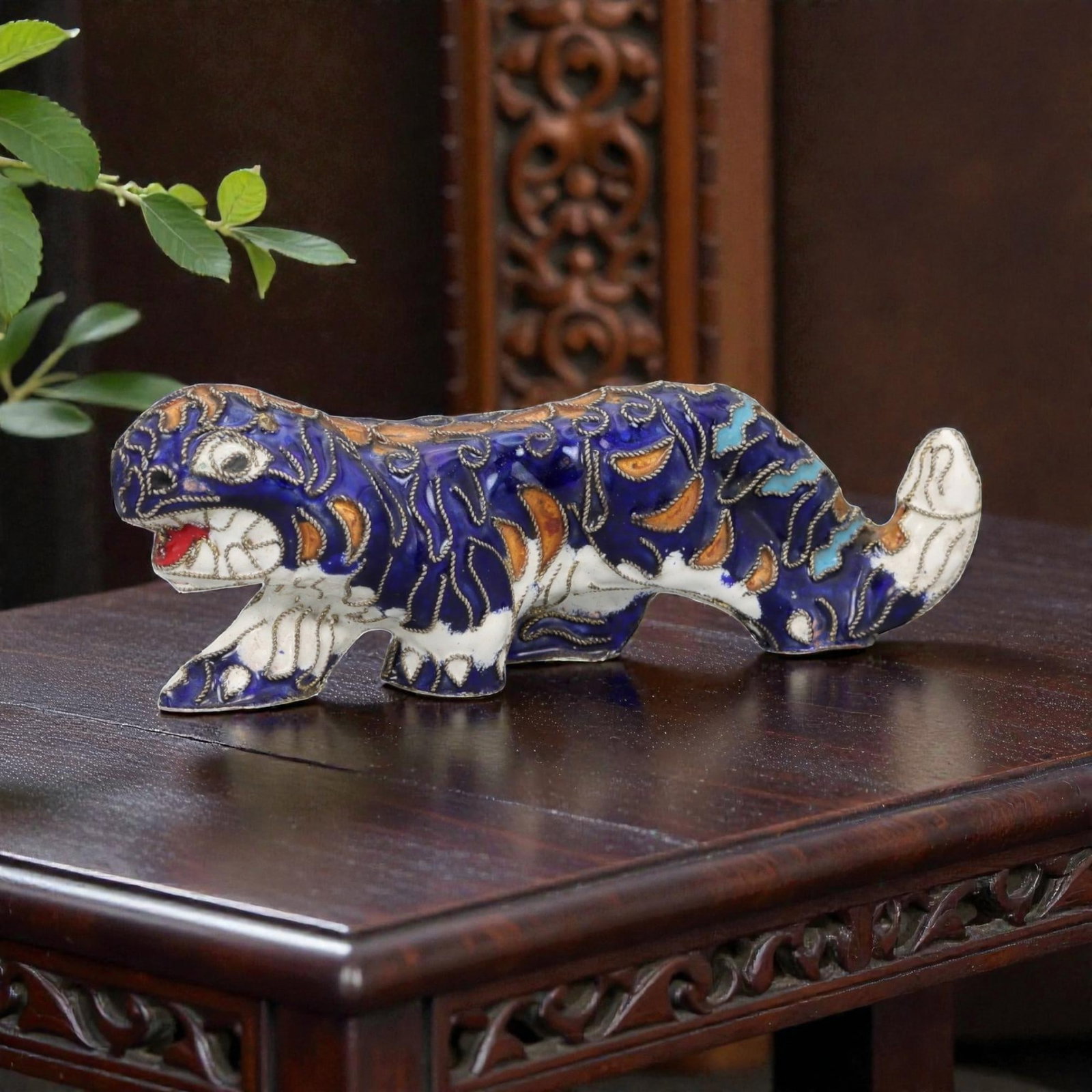 A Chinese Cloisonne Enamel Tiger Effigy, 20th Century, 4FH: Modeled as a striding tiger shown in profile with the body elongated and the head turned slightly forward, the effigy is constructed over a metal core and decorated overall with cloisonne enamel on a 
