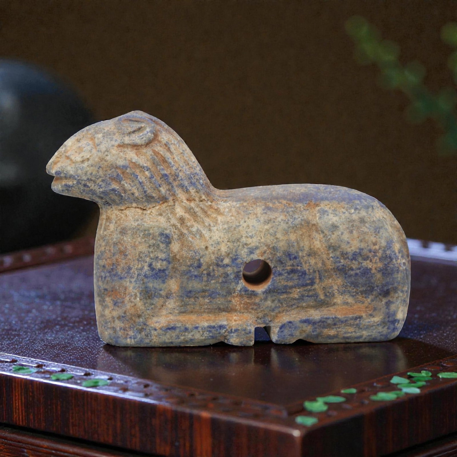 Ancient Lapis Lazuli Feline Amulet - Near Eastern Figurine, 61ZQ: Carved from deep blue lapis lazuli, this feline amulet features a stylized recumbent form with incised detailing for facial features and body texture. The stone exhibits natural pyrite inclusions and 
