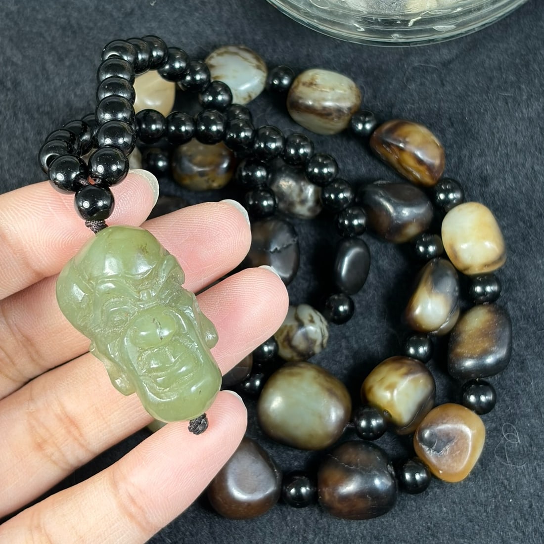 Natural Xinjiang Hetian Nephrite Black Skin Seed Pebble Necklace With Luohan Head Pendant, 37AT: This full-length wearable jade necklace strand measures 70 cm total length, crafted from authentic untreated Xinjiang Hetian nephrite river seed pebbles coated in rich natural black russet river skin 