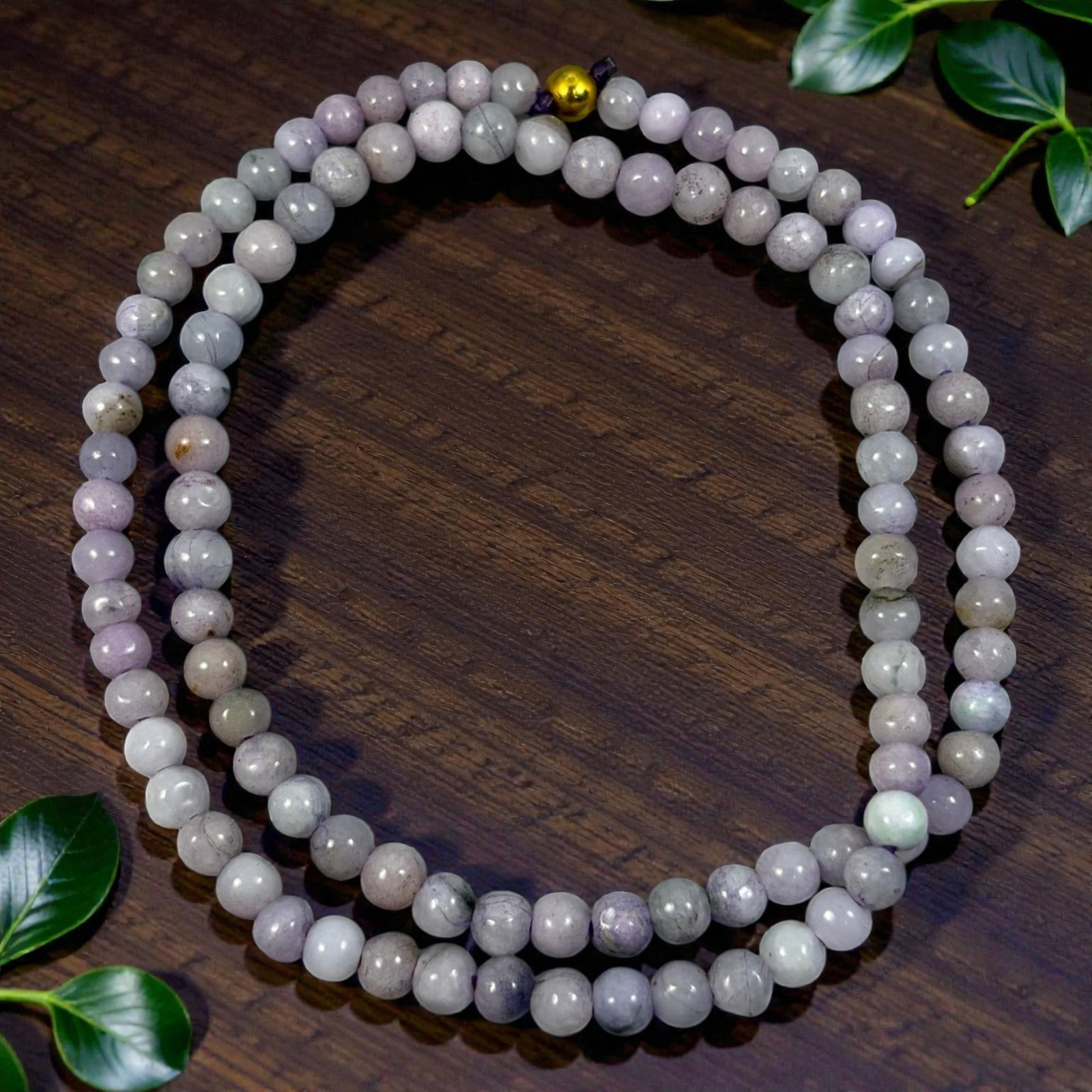Natural Burmese Lavender Type A Jadeite Jade Bead Necklace, 39YG: A continuous strand of evenly spherical polished Type A jadeite beads showcasing soft lavender and pale off-white blended natural coloration, with subtle internal mineral veining, faint inclusions and