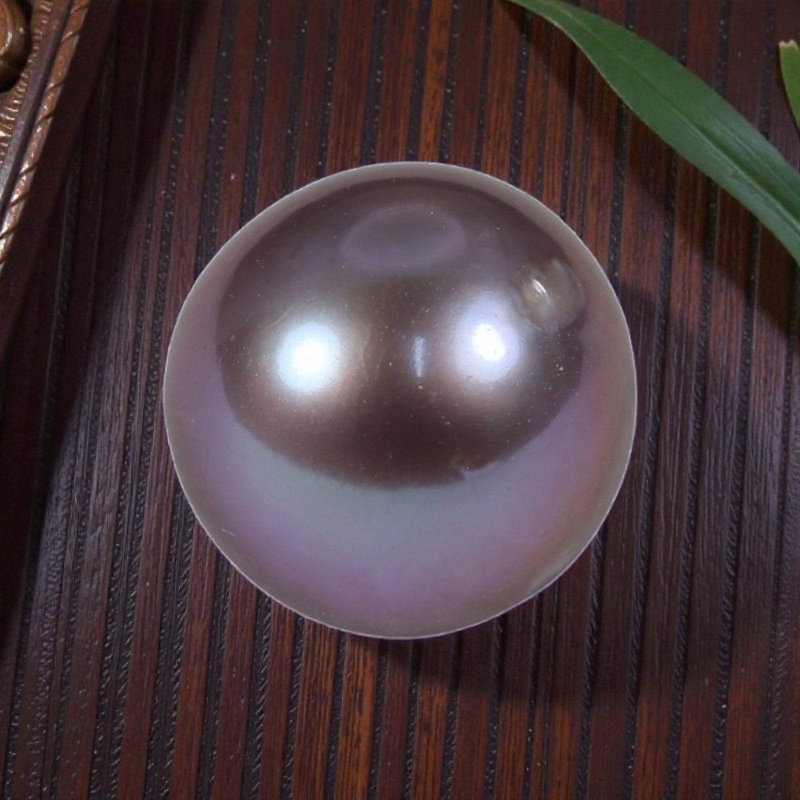 10.70ct Natural Fresh Water Pearl 11.4mm, 34YH: This is a natural freshwater pearl, showcasing a soft, iridescent mauve-pink hue with a smooth, polished surface and a high, mirror-like luster. The pearl features a perfectly round shape with even na