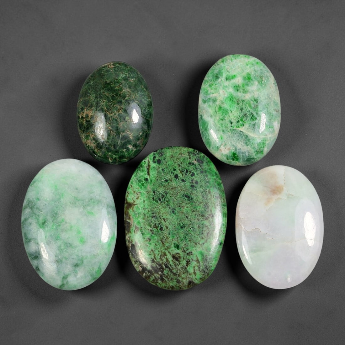 5pcs 123ct Natural Burmese Type A Dark Web Speckled Ice Jadeite Jade Cabochons, 77AV: This wholesale bulk set contains 5 fully untreated natural Burmese Type A oval jadeite jade cabochons with a total combined weight of 123ct, maximum dimension 32x22mm. The parcel showcases diverse nat