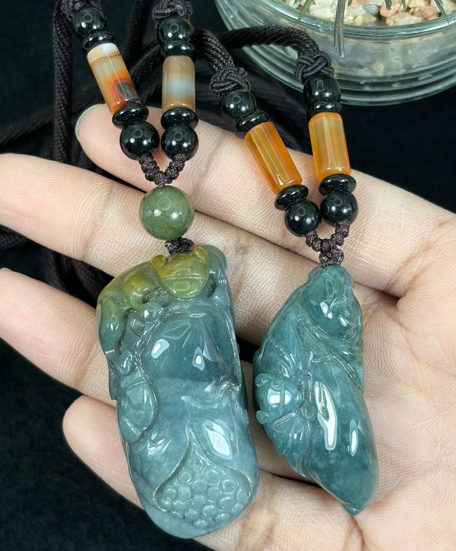 Lot of 2 Hand Carved Natural Burmese Type A Jadeite Jade Rope Pendant Necklaces, 86YJ: This two-piece set contains untreated natural Burmese Type A jadeite jade pendants polished to a glossy finish with organic blue-green jade tones and natural mineral mottling. One carving features a f