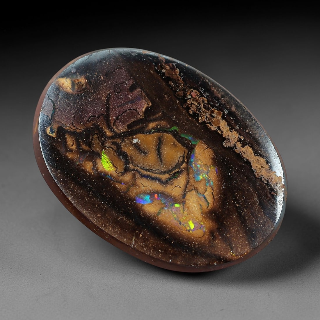 2.88 Carats Koroit Yowah Opal Cabochon - Natural Australian Single Stone, 67XL: This striking Koroit Yowah opal cabochon, measuring 11.2x8.1x3.0mm, features a dense, layered ironstone matrix in deep chocolate brown and jet black, with a prominent, irregular inclusion of pale, cre