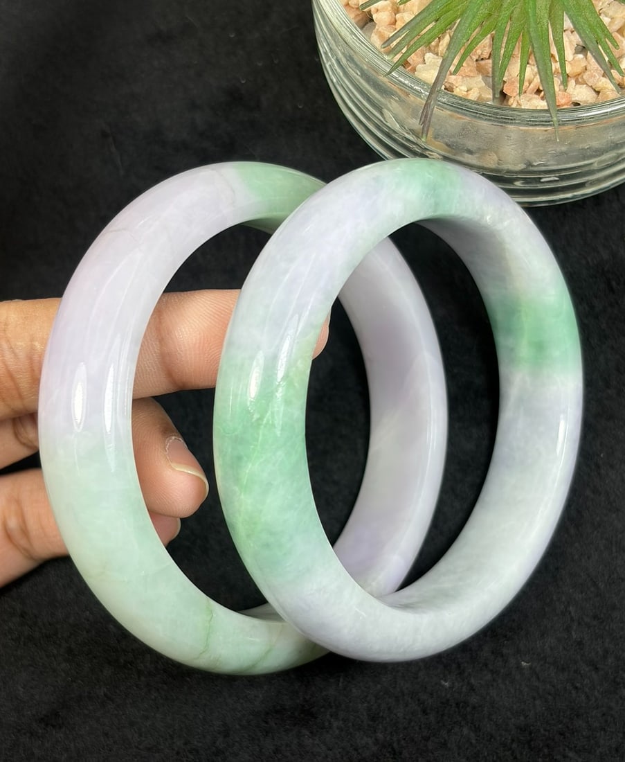 Lot of 2 Natural Burmese Type A Lavender Green Jadeite Bangles, 56.7mm & 58mm Inner Diameter, 30AV: Two untreated genuine Type A jadeite bangles sized 56.7mm and 58mm inner diameter, soft pale lavender base naturally blended with vibrant bright green floating patches, smooth wide polished bands with