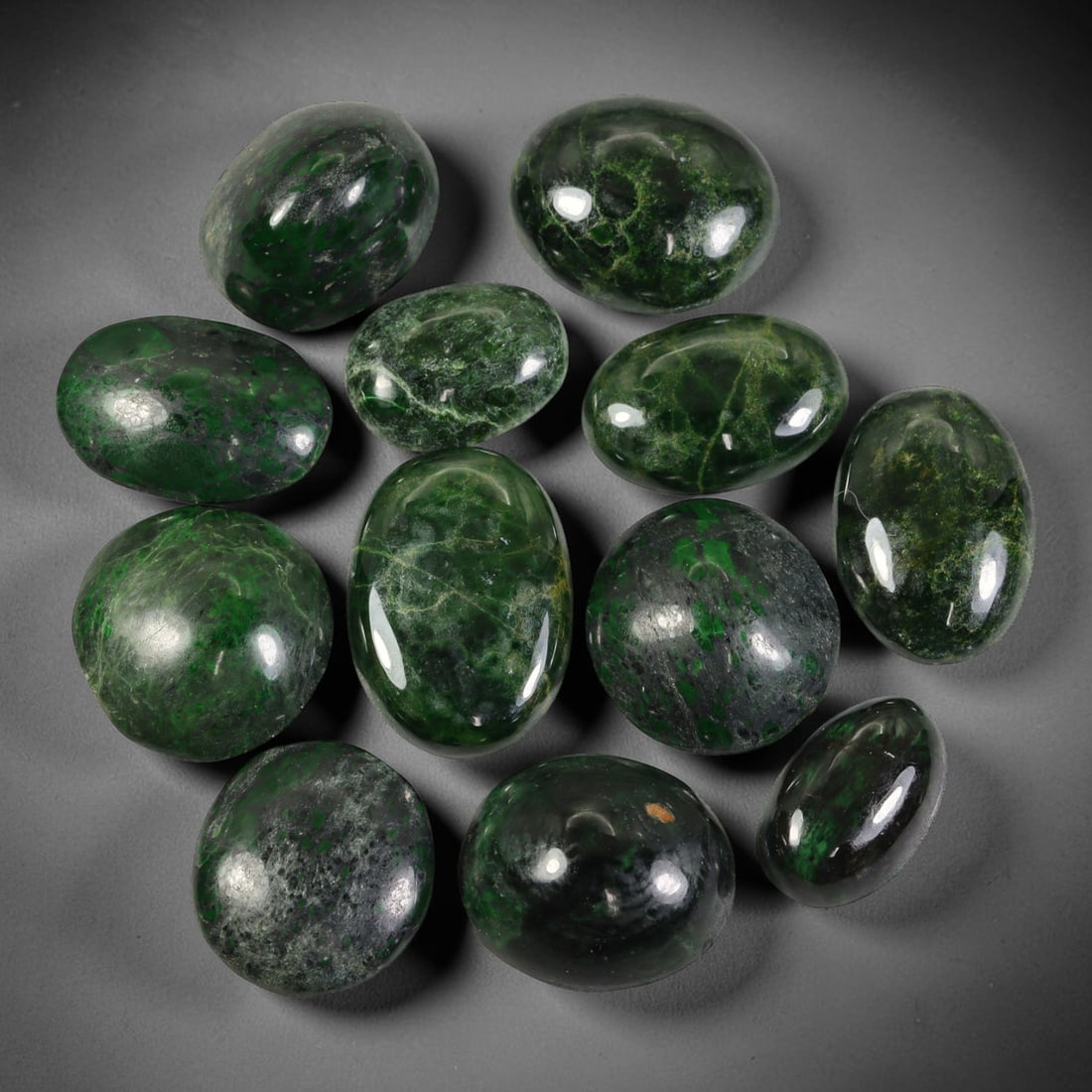 Lot of 12pcs 152ct Natural Burmese Type A Deep Forest Green Web Veined Jadeite Jade Cabochons, 52AV: This wholesale bulk set includes 12 fully untreated natural Burmese Type A jadeite jade oval cabochons with a total combined weight of 152ct, uniform maximum dimension of 21x15mm. Every stone boasts a