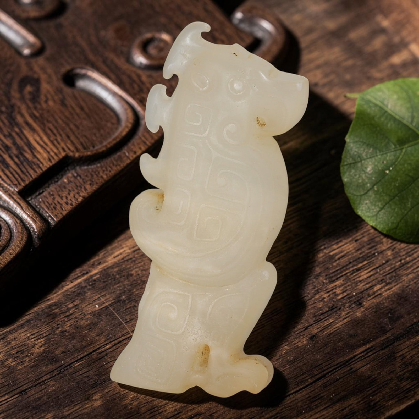 Chinese Jade Carved Pendant - Stylized Mythical Beast Figurine, 77AS: Crafted from solid Chinese jade, this piece is executed with traditional hand-carving techniques, featuring precise incised detailing and smooth polished surfaces across the elongated flattened form. 