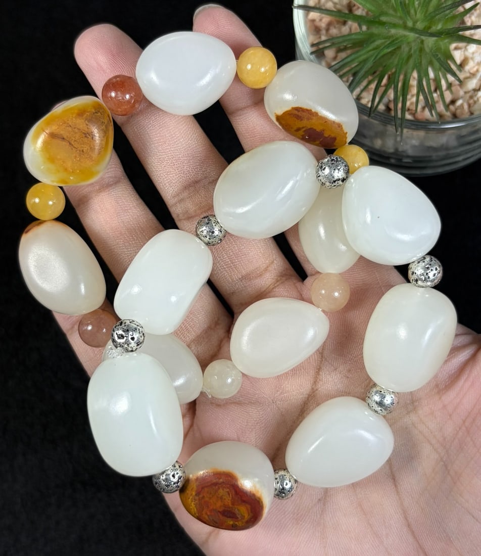 Lot of 2 Natural White Hetian Nephrite Seed Jade Bracelets, Largest 2cm Raw Skin Pebble Beads, 82AR: Set of 2 stretch hand-strung bracelets crafted from polished natural white Hetian nephrite river seed jade tumbled pebbles, maximum oval bead size at 2cm; creamy milky white stone accented with natura