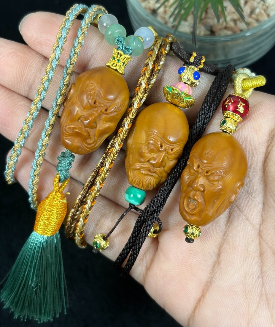 Lot of 3 Hand Carved Olive Nut Arhat Head Pendant Rope Necklaces, 18YJ: This three-piece set features hand-carved olive nut pendants sculpted into detailed arhat head busts with expressive facial textures and fine surface carving, each strung on braided decorative cord ac