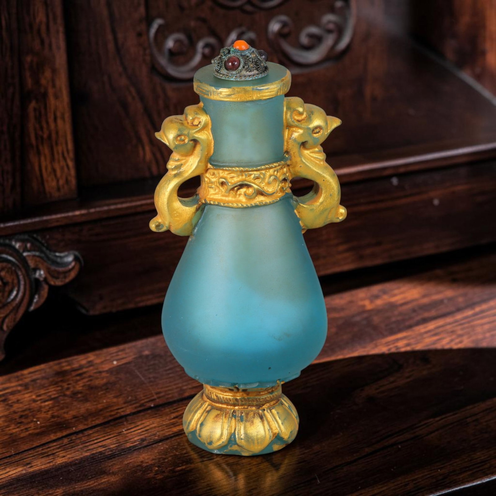 Vintage Chinese Liuli Glass Snuff Bottle - Gilt Phoenix Handle Lotus Base Vessel, 30AS: This tall pear-form snuff bottle is crafted from frosted translucent turquoise vintage Chinese liuli glass, adorned with elaborate gilded decorative metalwork throughout its structure. Symmetric sculp