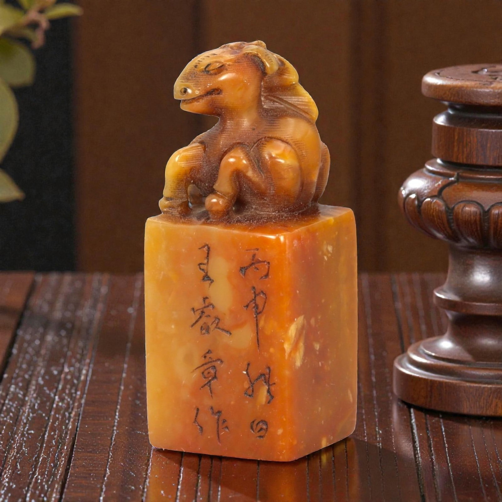 A Chinese Shoushan Stone Horse-Form Seal, 20th Century, 15FA: Carved from warm amber-toned Shoushan stone with natural translucency and subtle tonal variation, the seal is surmounted by a recumbent horse modeled in the round. The animal is rendered with a rounde