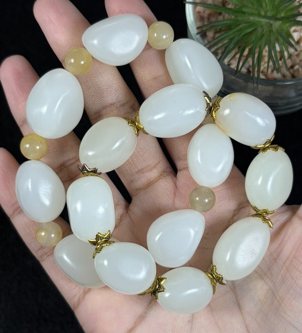 Lot of 2 Natural White Hetian Nephrite Seed Jade Bracelets, Largest 2cm Raw Skin Pebble Beads, 90AR: Set of 2 stretch hand-strung bracelets crafted from polished natural white Hetian nephrite river seed jade tumbled pebbles, maximum oval bead size at 2cm; creamy milky white stone accented with natura