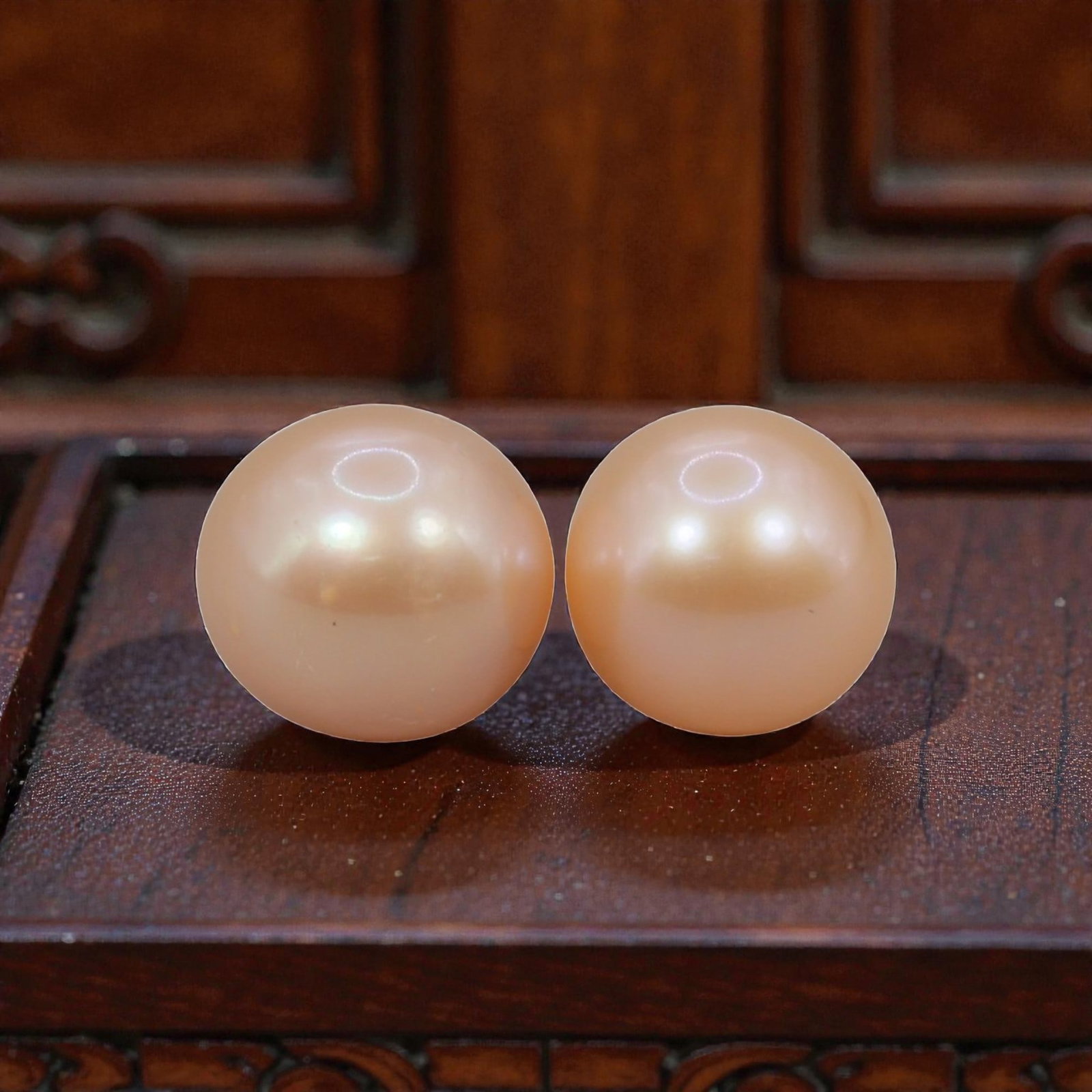 Freshwater Pearl Pair - Natural Pearl Peach Round Gemstones 8mm, 38XA: A matched pair of natural freshwater pearls, exhibiting a soft peach-gold hue with bright, uniform luster and subtle iridescent orient. The pearls are near-spherical, with smooth nacre and minor natur