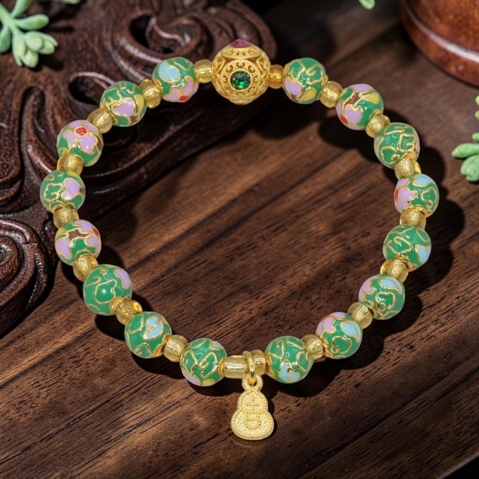 A Chinese Cloisonne Enamel Beaded Bracelet - Green Gold-Tone Gourd Charm, 48YJ: This modern Chinese-style bracelet features 11.21mm round cloisonne enamel beads in a vibrant green hue, each detailed with raised gold-tone floral patterns accented with purple, pink, and light blue 