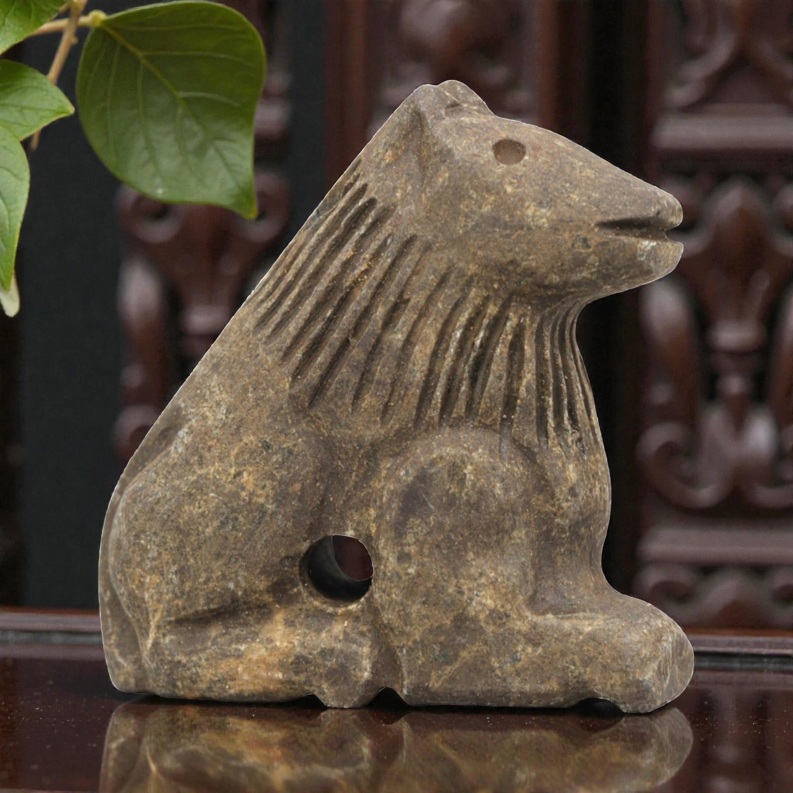 Ancient Stone Lion Effigy Amulet - Near Eastern Protective Figurine, 91ZP: This artifact is a carved stone lion effigy amulet, executed in the stylized zoomorphic tradition of the ancient Near East. The amulet depicts a seated lion with simplified anatomical features: incise