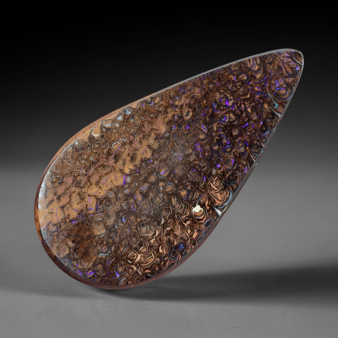 4.19 Carats Koroit Yowah Opal Cabochon - Natural Australian Single Stone, 72XL: This substantial Koroit Yowah opal cabochon, measuring 18x9.3x2.9mm, features a dense, textured ironstone matrix in layered tones of deep chocolate brown, warm tan, and jet black. The stone's internal
