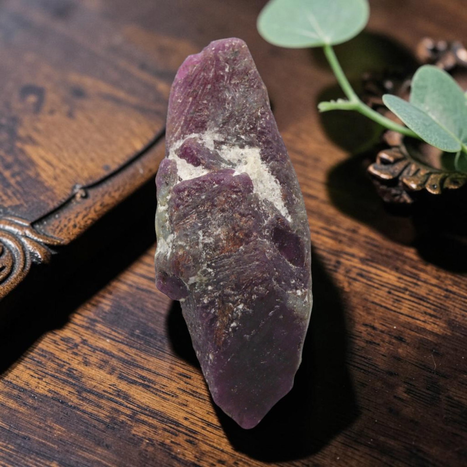 14.50ct Natural Mauritania Ruby Rough (Unheated), 67XE: This unheated Mauritania ruby rough is a captivating natural crystal specimen, featuring vivid magenta-purple ruby formations embedded in a contrasting greyish matrix. The stone's rugged, unpolished s