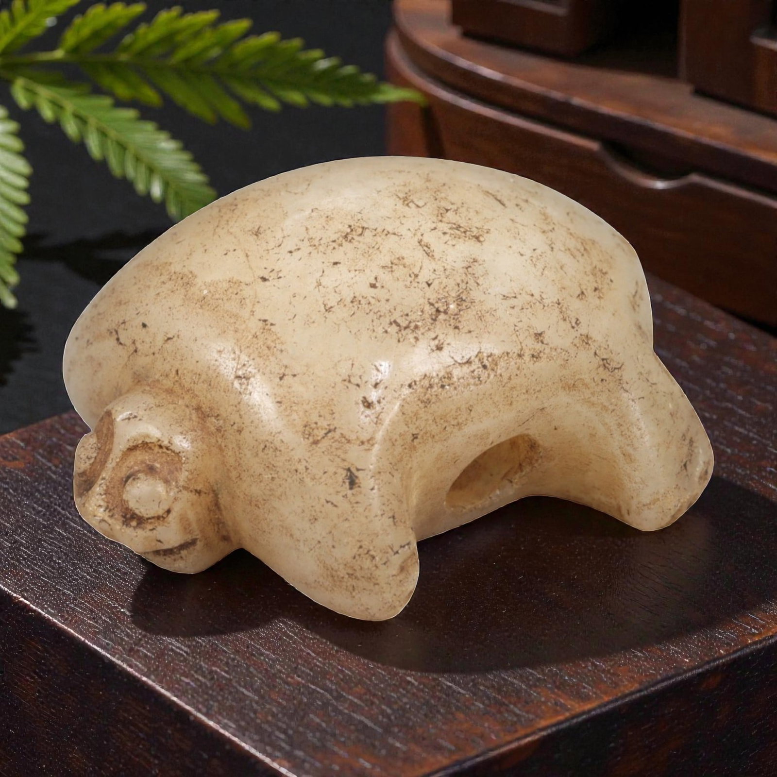 Ancient Stone Tortoise - Near Eastern Amulet Figurine, 1AL: Carved from smooth, pale stone, this amulet depicts a stylized tortoise with a rounded shell, simplified facial features, and short limbs, with a lateral suspension hole for wearable use. Attributed t
