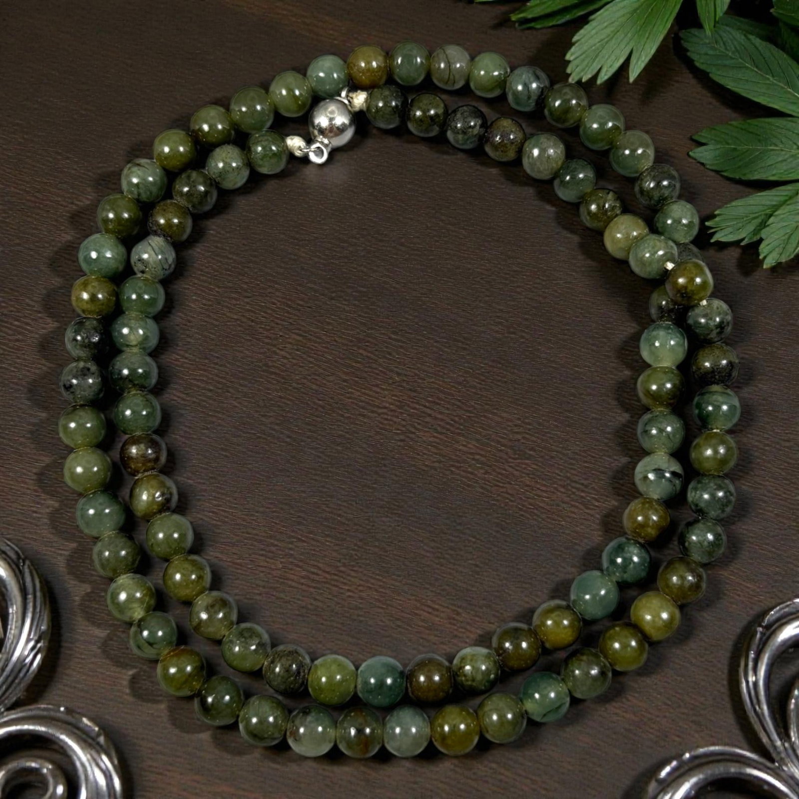 Natural Burmese Variegated Green Type A Jadeite Jade Bead Necklace, 33YG: A continuous strand of uniformly spherical polished Type A jadeite beads featuring blended deep forest green, olive, and amber-brown variegated patterning, naturally occurring mineral veining, and sca
