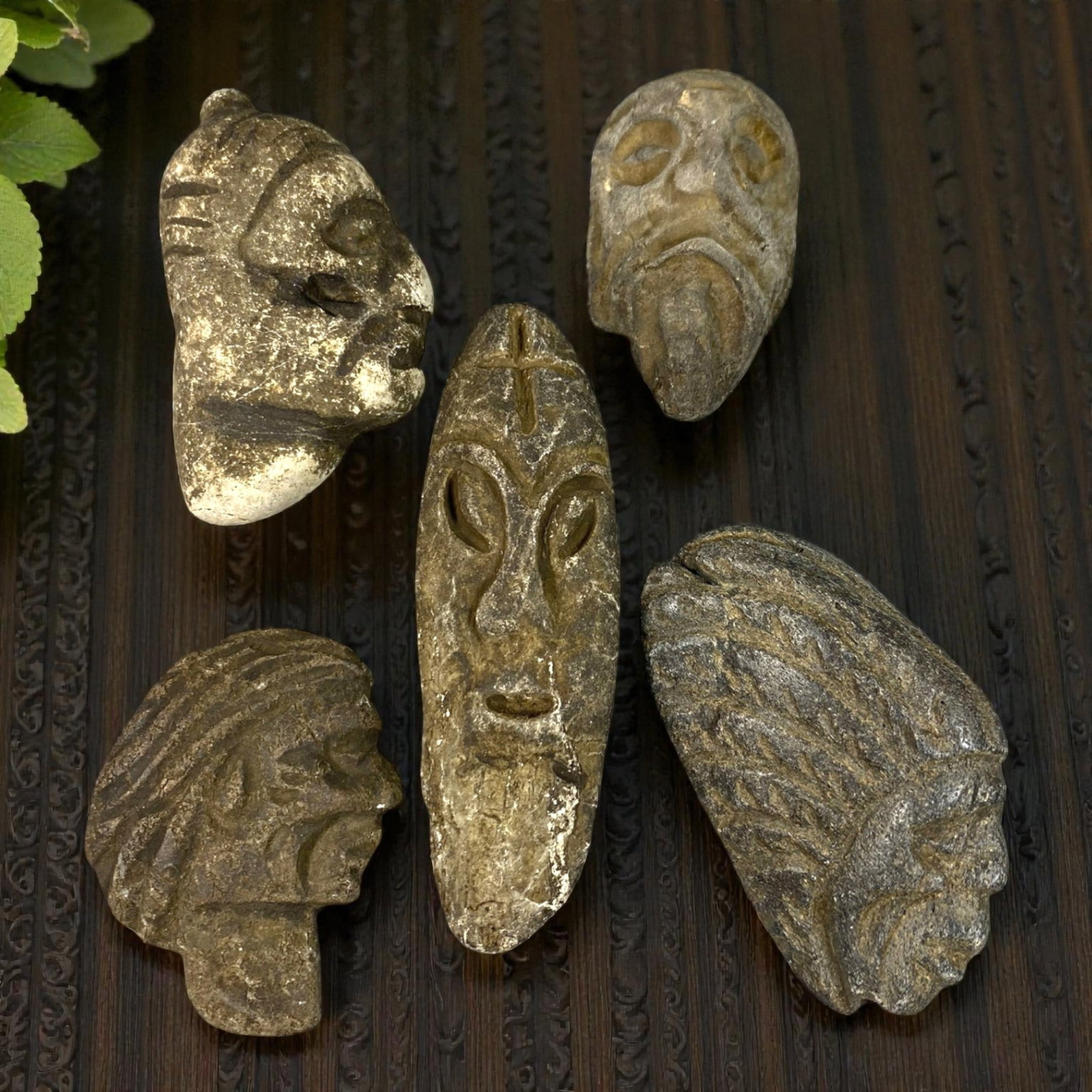 Lot of 5 Medieval Mediterranean Stone Head Carvings, 80AG: A collection of five hand-carved stone head carvings, attributed to medieval tribal or folk art traditions of the Mediterranean region. Crafted from weathered stone in varying earthy tones, the pieces