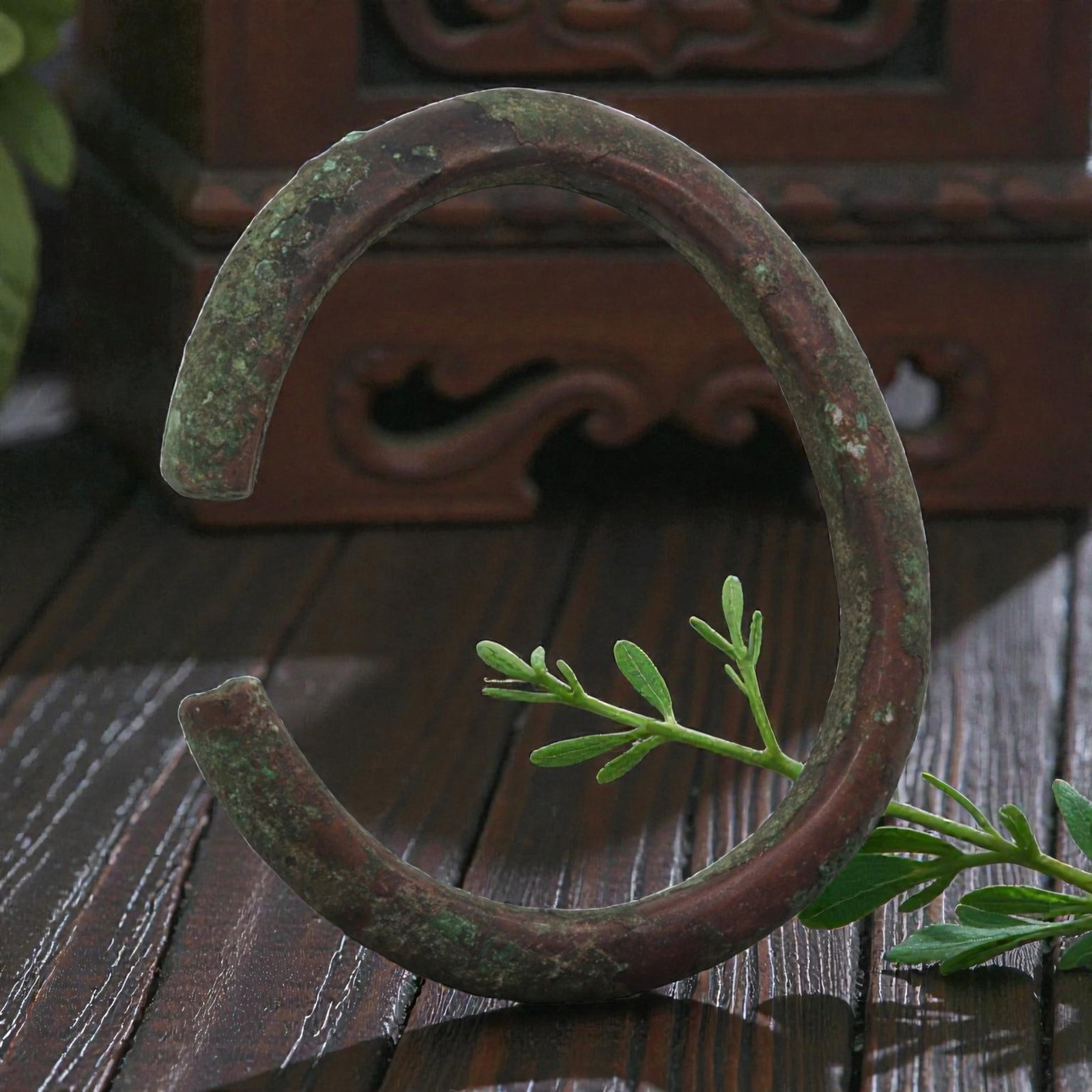 Ancient Bronze Bracelet - Roman Penannular Bangle, 26BN: A penannular bronze bracelet of ancient Roman origin, formed from a thick, rounded bronze band with a robust profile. The open terminals are plain, with subtle signs of shaping typical of Roman provin