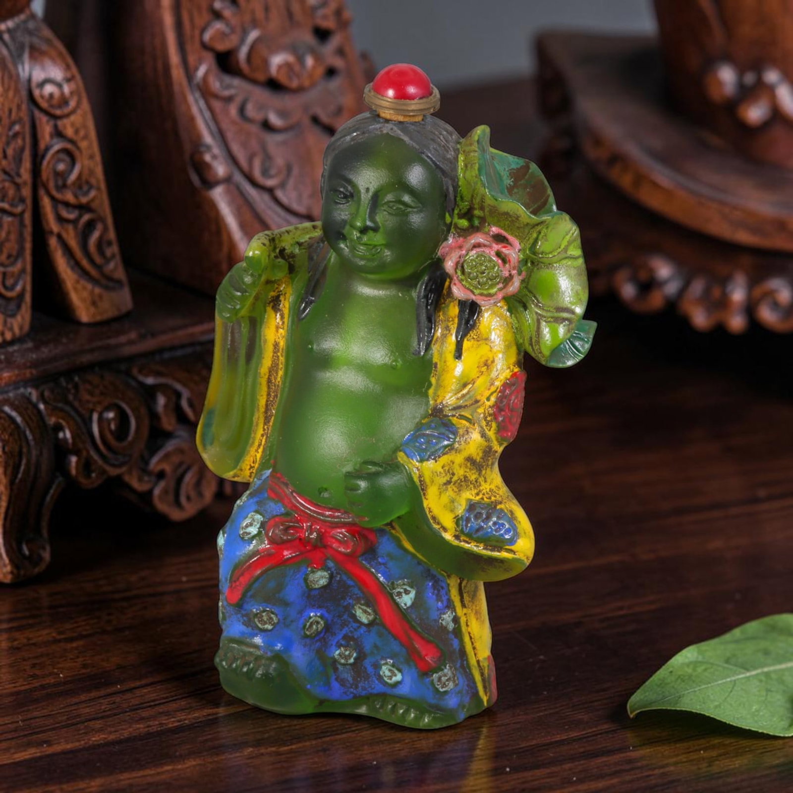 Vintage Chinese Painted Emerald Liuli Glass Snuff Bottle - He He Immortal With Lotus Figurine, 48AS: This fully sculpted anthropomorphic snuff bottle is formed from frosted translucent emerald vintage Chinese liuli glass, shaped as a traditional He He Er immortal figure with a gentle smiling face and