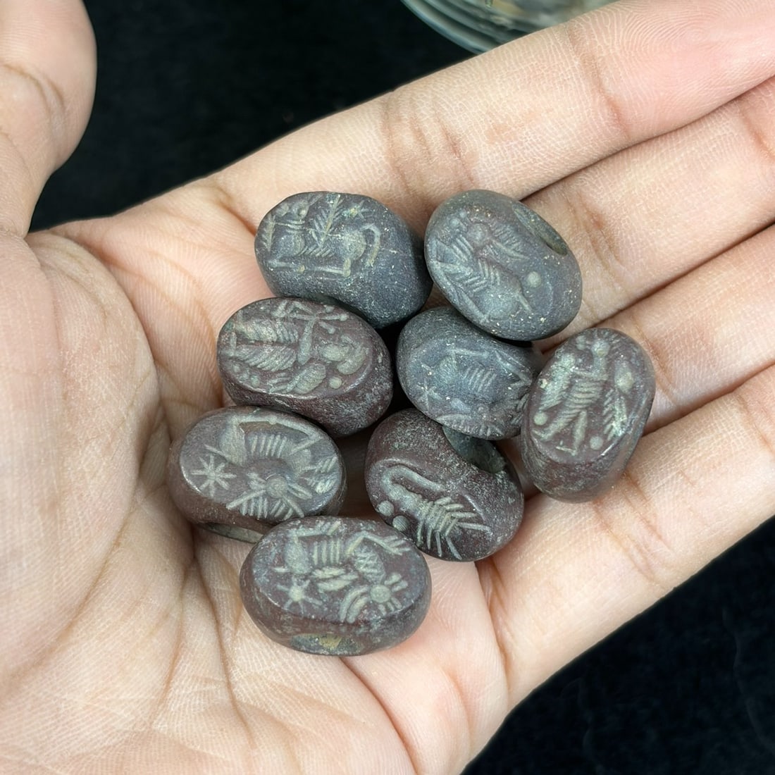 Lot of 8 Ancient Sasanian Era Steatite Intaglio Stamp Seal Amulets, 71AR: This eight-piece antiquity set features hand-carved oval pebble stamp seals crafted from dark reddish-brown steatite stone. Each seal bears finely incised ancient zoomorphic intaglio motifs including 