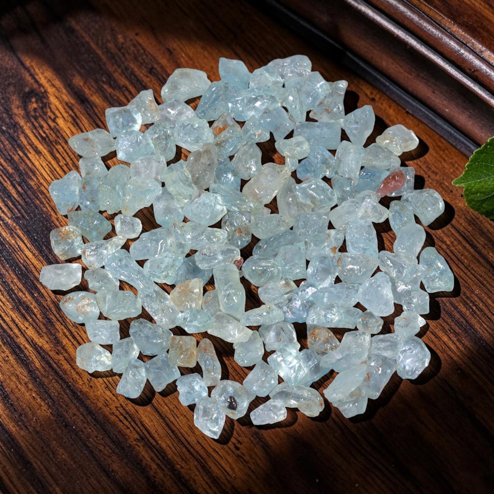 120.97 Carats Natural Aquamarine Rough Parcel, 91YH: This luminous parcel of natural aquamarine rough showcases the classic soft sky-blue hue the gem is known for, ranging from pale, translucent tones to deeper, more saturated blues. The stones are in t