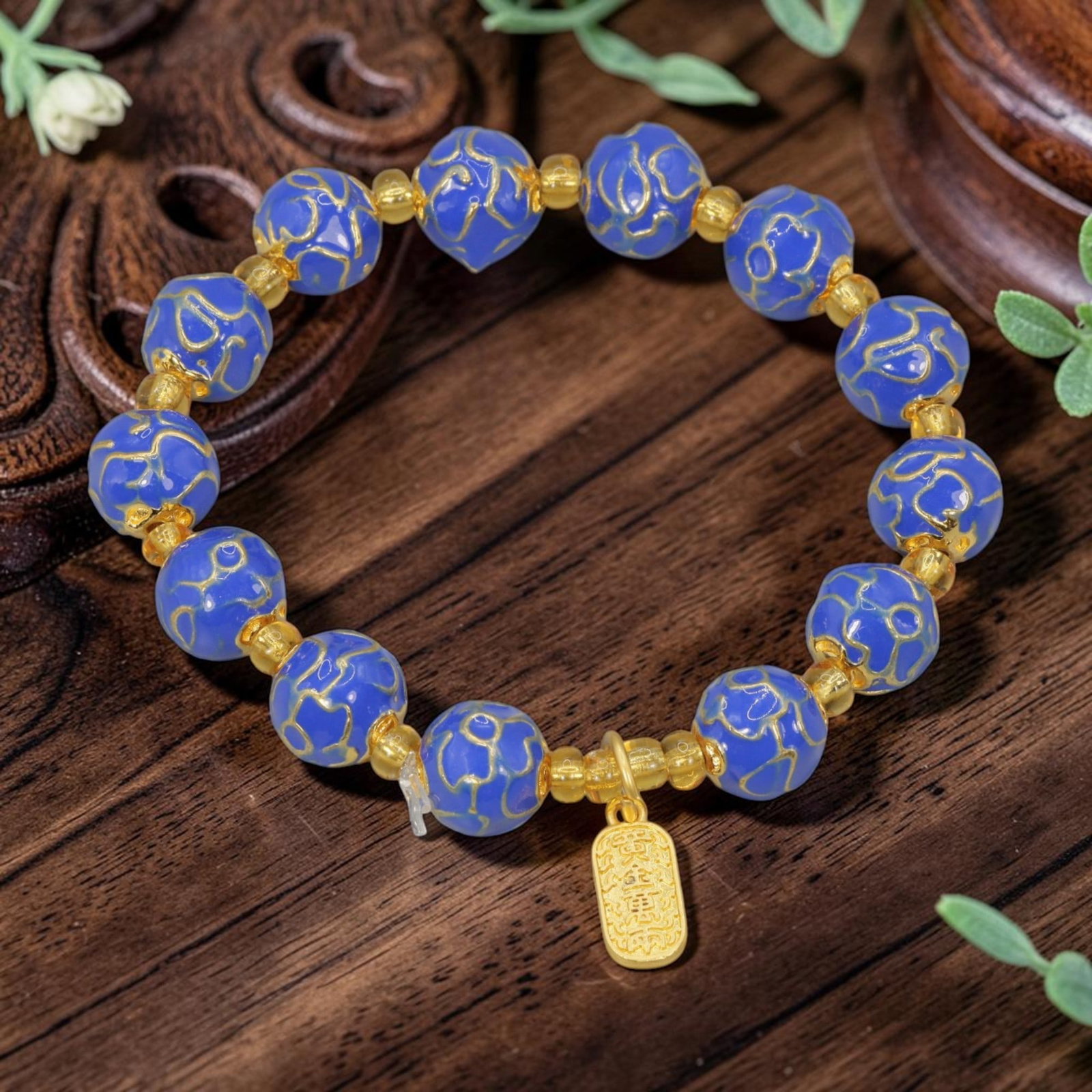 A Chinese Cloisonne Enamel Beaded Bracelet - Blue Gold-Tone Good Fortune Charm, 30YJ: This modern Chinese-style bracelet features 10.40mm round cloisonne enamel beads in a rich royal blue hue, each detailed with raised gold-tone cloud patterns. Small smooth gold-tone spacer beads separ