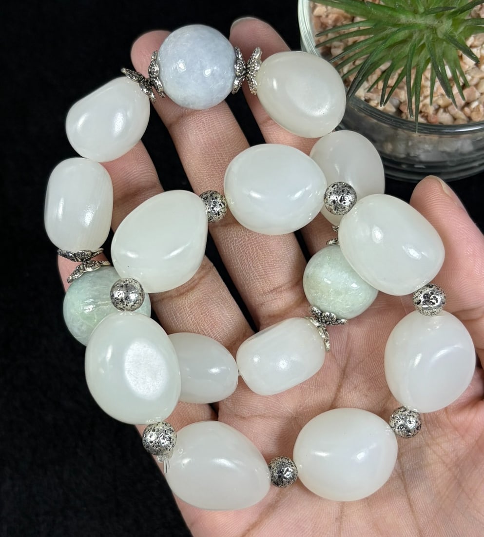 Lot of 2 Natural White Hetian Nephrite Seed Jade Bracelets, Largest 2cm Raw Skin Pebble Beads, 77AR: Set of 2 stretch hand-strung bracelets crafted from polished natural white Hetian nephrite river seed jade tumbled pebbles, maximum oval bead size at 2cm; creamy milky white stone accented with natura