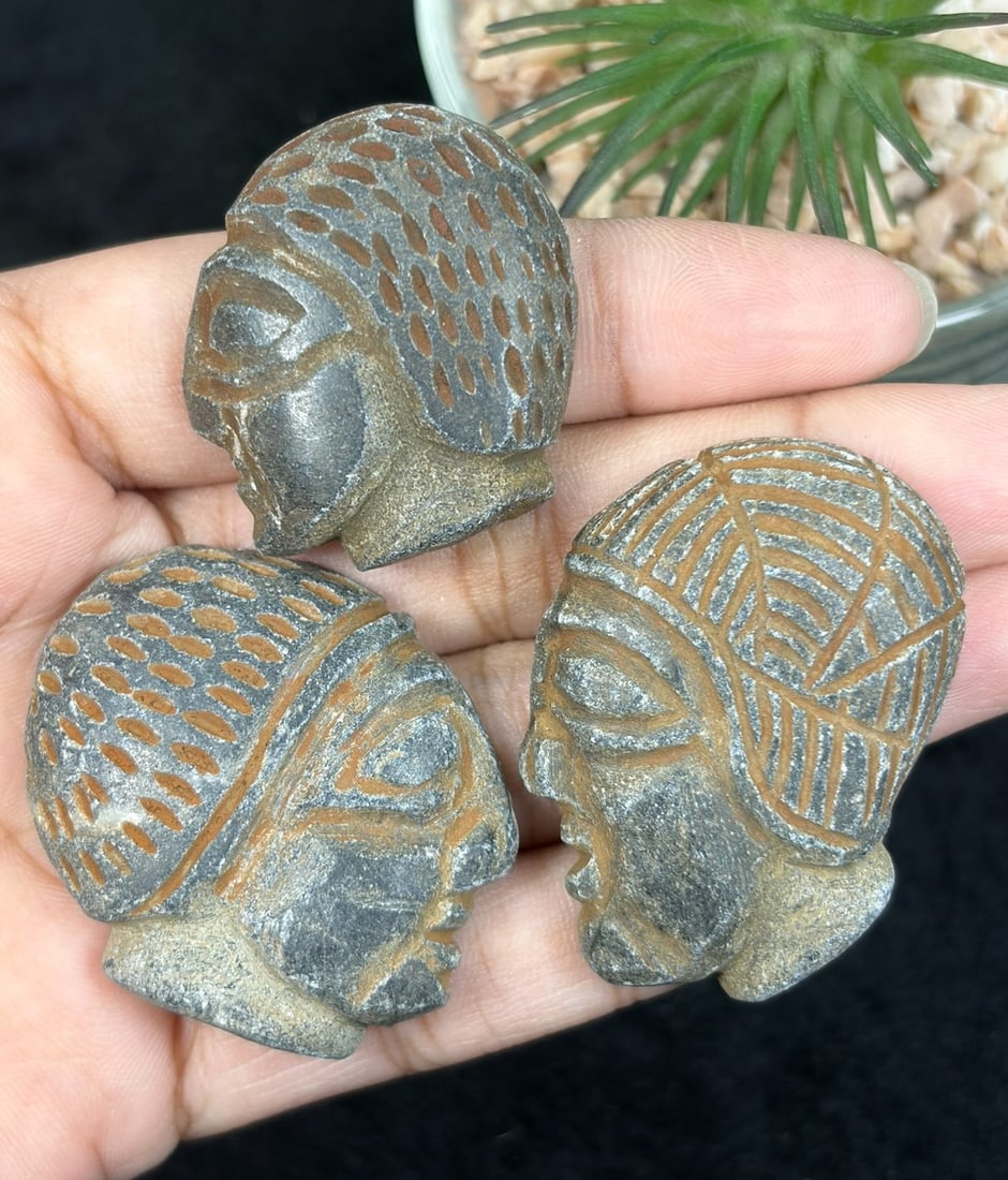 Lot Of 3 Antique Egyptian Schist Intaglio with Profile Head Motif, 35YD: Each specimen is hand-carved from schist stone, featuring incised detailing forming stylized human profile heads with intricate patterned headdress ornamentation, defined facial planes, and recessed l