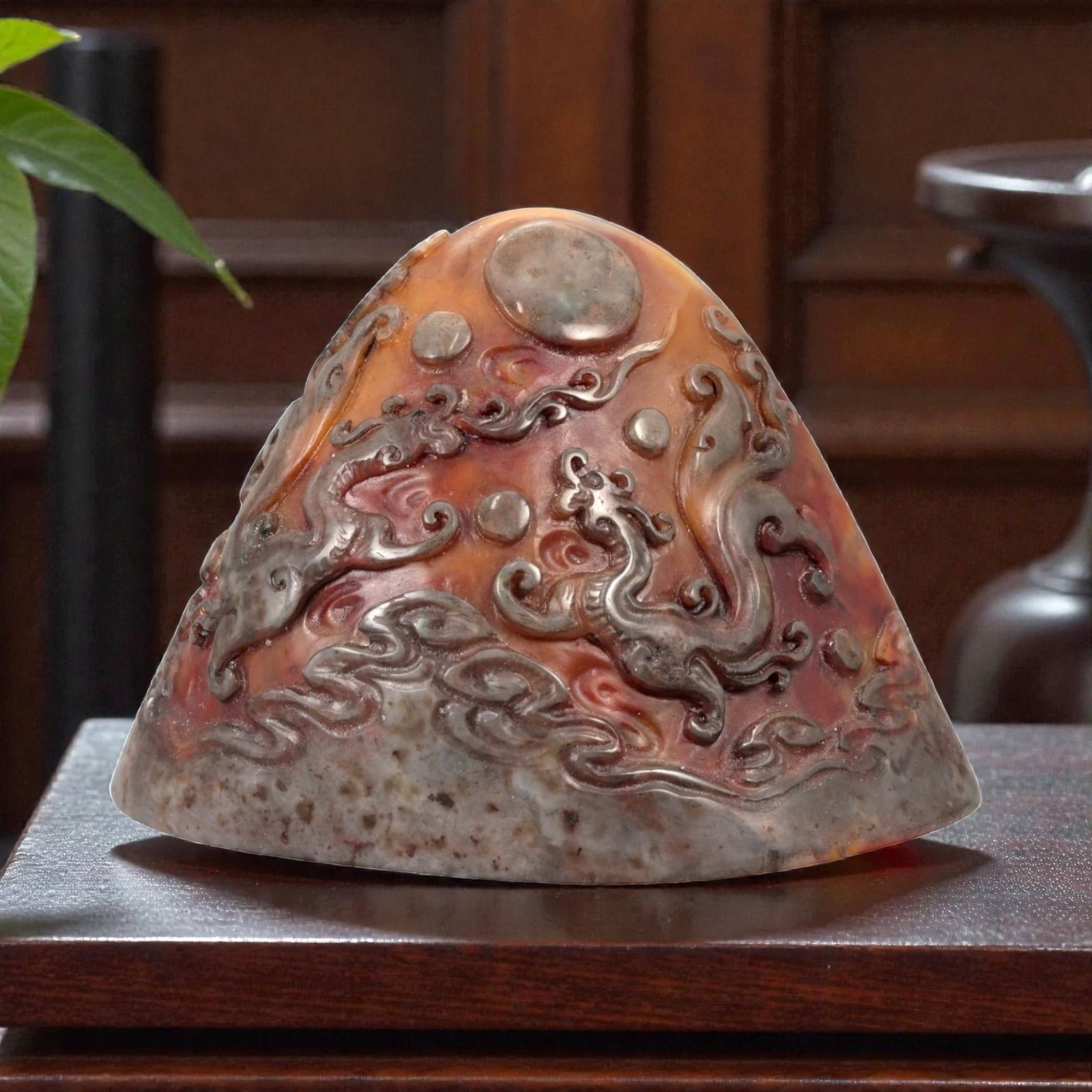A Chinese Shoushan Stone Stamp Seal, 20th Century, 1FA: Carved from variegated Shoushan stone displaying tones of reddish-brown, russet, and grey with natural mottling, the seal is worked with a tapering, irregularly domed upper section and a flat oval sea