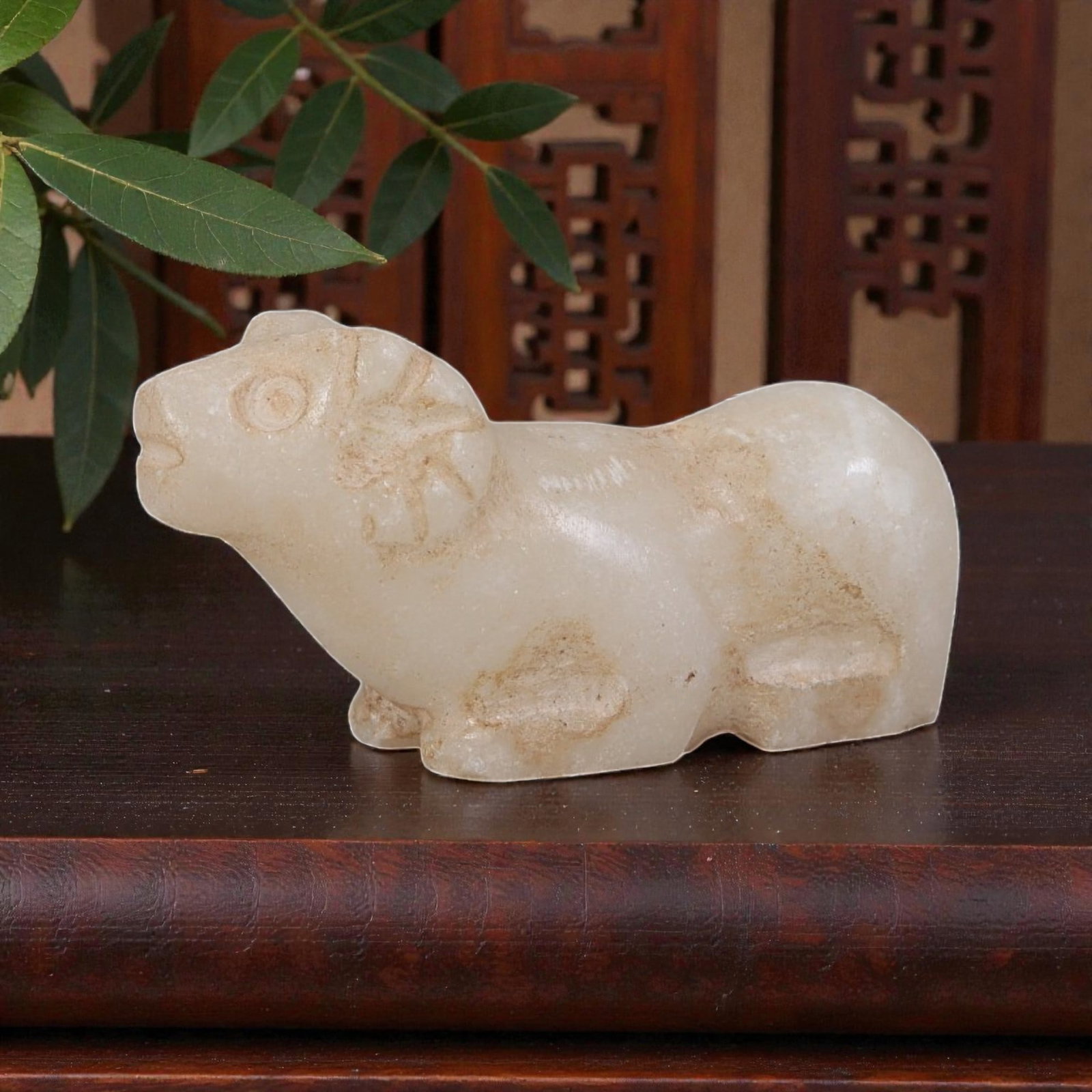 Ancient Bactrian Zoomorphic Marble Amulet, Circa 3rd-2nd Millennium BCE, 88YD: This ancient zoomorphic amulet is carved from pale, creamy marble, depicting a stylized recumbent ram or bovid figure in profile. The form features simplified anatomical details including the head wit