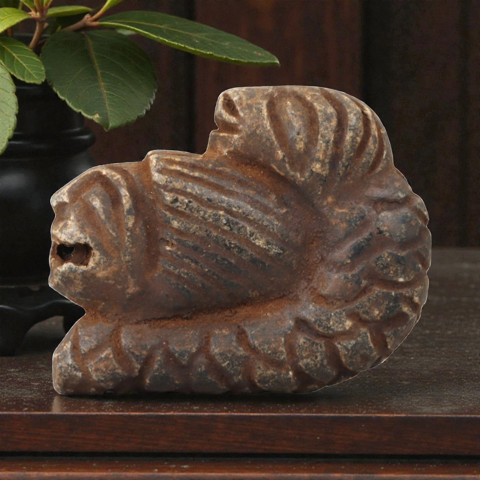 Ancient Steatite Lion - Near Eastern Amulet Figurine, 97AK: Carved from steatite, this amulet depicts a recumbent lion with incised linear details defining the mane, facial features, and body, including a suspension hole in the muzzle for wearable use. Attribu